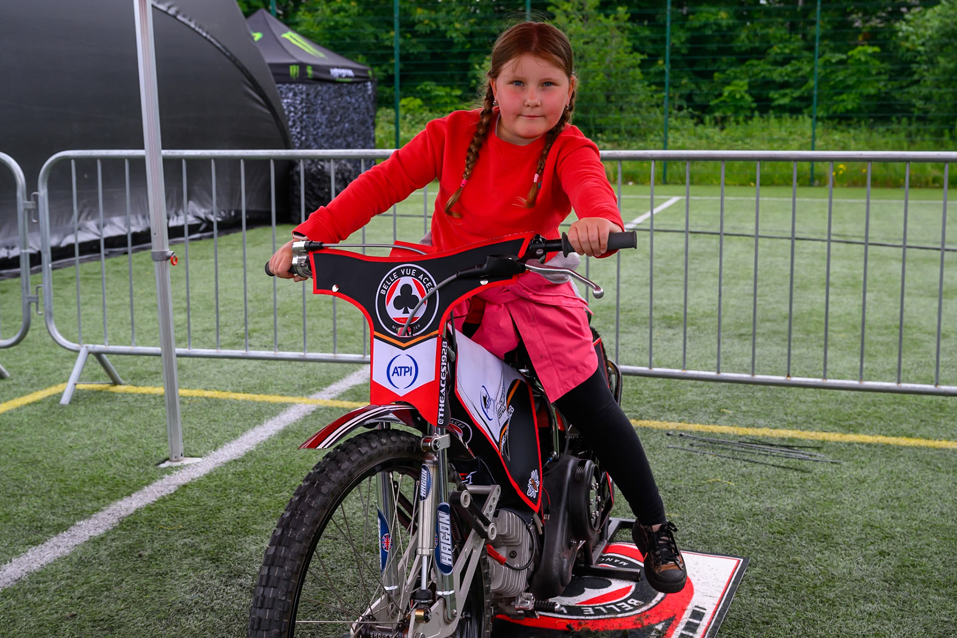 A young fan gets a chance to sit on a Speedway Bike during the ATPI  FIM Speedway GP of Manchester at the National Speedway Stadium, Manchester on Saturday 6th June 2026. (Photo: Ian Charles | MI News)