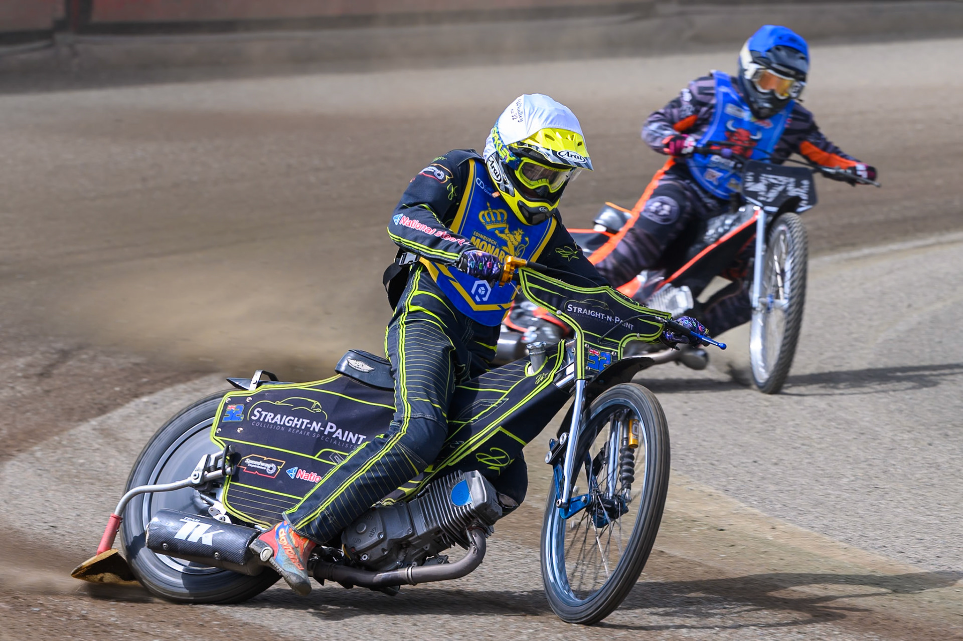 Ben Whalley of Edinburgh Monarchs Academy in White leading Jack Roberts of Buxton Bulls in Blue during the WSRA National Development League match between Buxton Bulls and Edinburgh Monarchs Academy at Hi-Edge Speedway, Buxton on Sunday 14th June 2026. (Photo: Ian Charles | MI News)