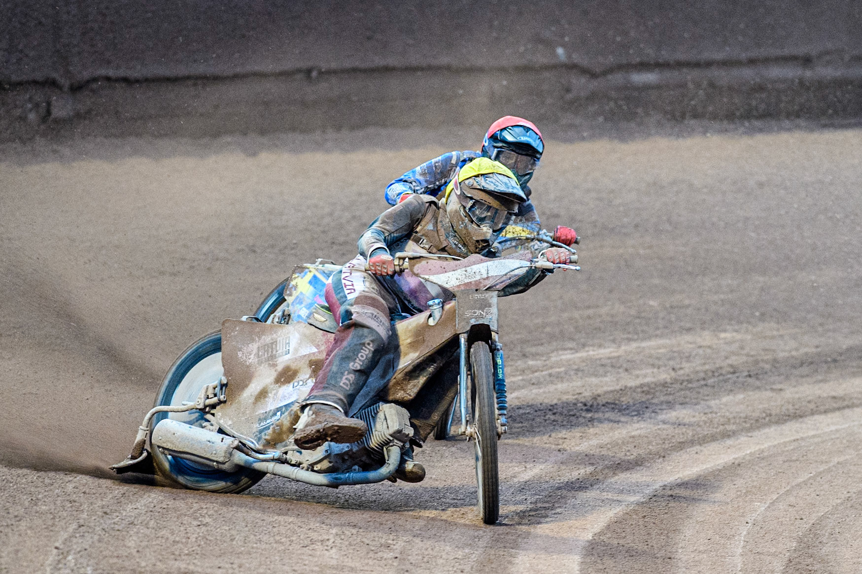 Artjoms Juhno of Latvia in Yellow leading Philip Hellström-Bängs of Sweden in Red lduring the Monster Energy FIM Speedway of Nations 2 (Under 21) Final at the National Speedway Stadium, Manchester on Friday 12th July 2024. (Photo: Ian Charles | MI News)