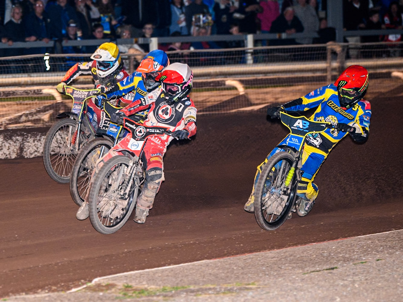 Belle Vue Aces' Dan Bewley   in White leading Sheffield Tigers' Chris Holder  in Red, Sheffield Tigers' Josh Pickering  in Blue and Belle Vue Aces' Jake Mulford   in Yellow during the Rowe Motor Oil Premiership match between Sheffield Tigers and Belle Vue Aces at Owlerton Stadium, Sheffield on Monday 26th August 2024. (Photo: Ian Charles | MI News)