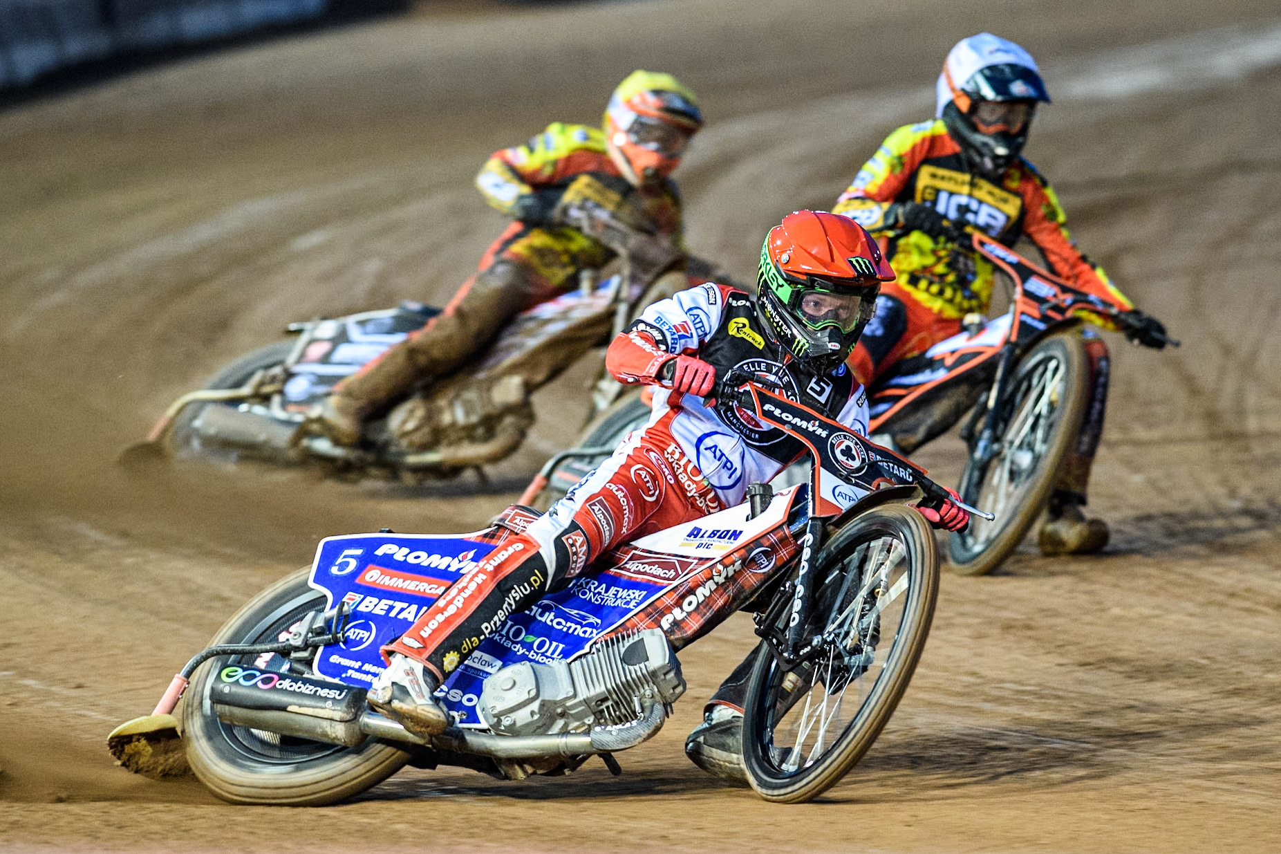 Dan Bewley of Belle Vue Aces in Red leading Sam Masters of Leicester Lions in White and Luke Becker of Leicester Lions in Yellow during the Rowe Motor Oil Premiership match between Belle Vue Aces and Leicester Lions at the National Speedway Stadium, Manchester on Saturday 6th April 2024. (Photo: Ian Charles | MI News)