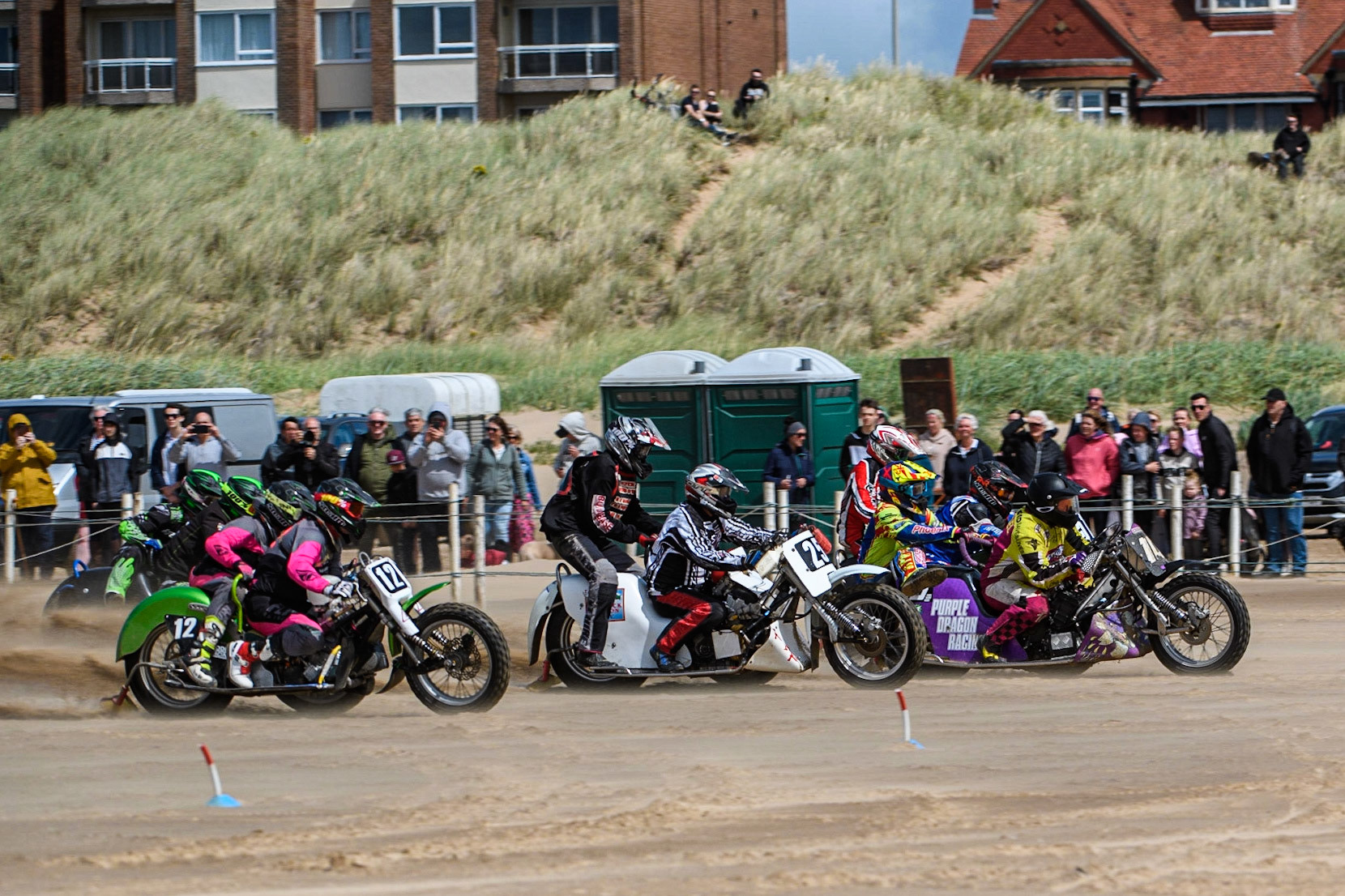 The 1000cc sidecars race away from the start line with Clint Blondell &amp; Richard Webb (10) leading the pack during the Fylde ACU British Sand Racing Masters Championship at  St Annes on Sea, Lancashire on Sunday 30th July 2023. (Photo: Ian Charles | MI News)