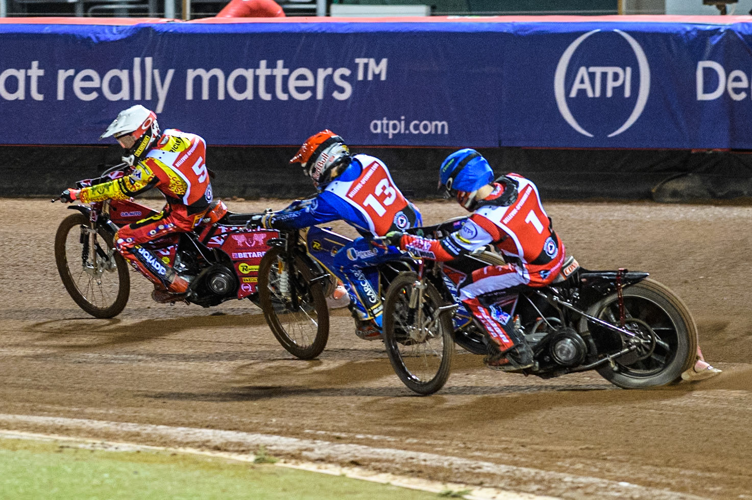 England's Connor Bailey (Blue) chases England's Robert Lambert (Red) and Australia's Max Fricke (White) during the Peter Craven Memorial Trophy meeting at the National Speedway Stadium, Manchester on Monday 18th March 2024. (Photo: Ian Charles | MI News)