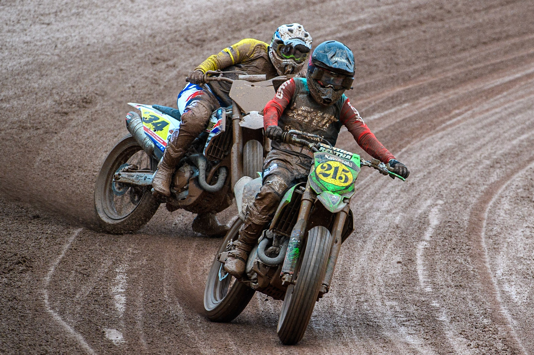 Ferran Sastre Martinez (215) from Spain leads Ervin Krajčovič (34) from Czech Rep. during the FIM World Flat Track Championship Round 1 at the National Speedway Stadium, Manchester on Saturday 5th August 2023. (Photo: Ian Charles | MI News)