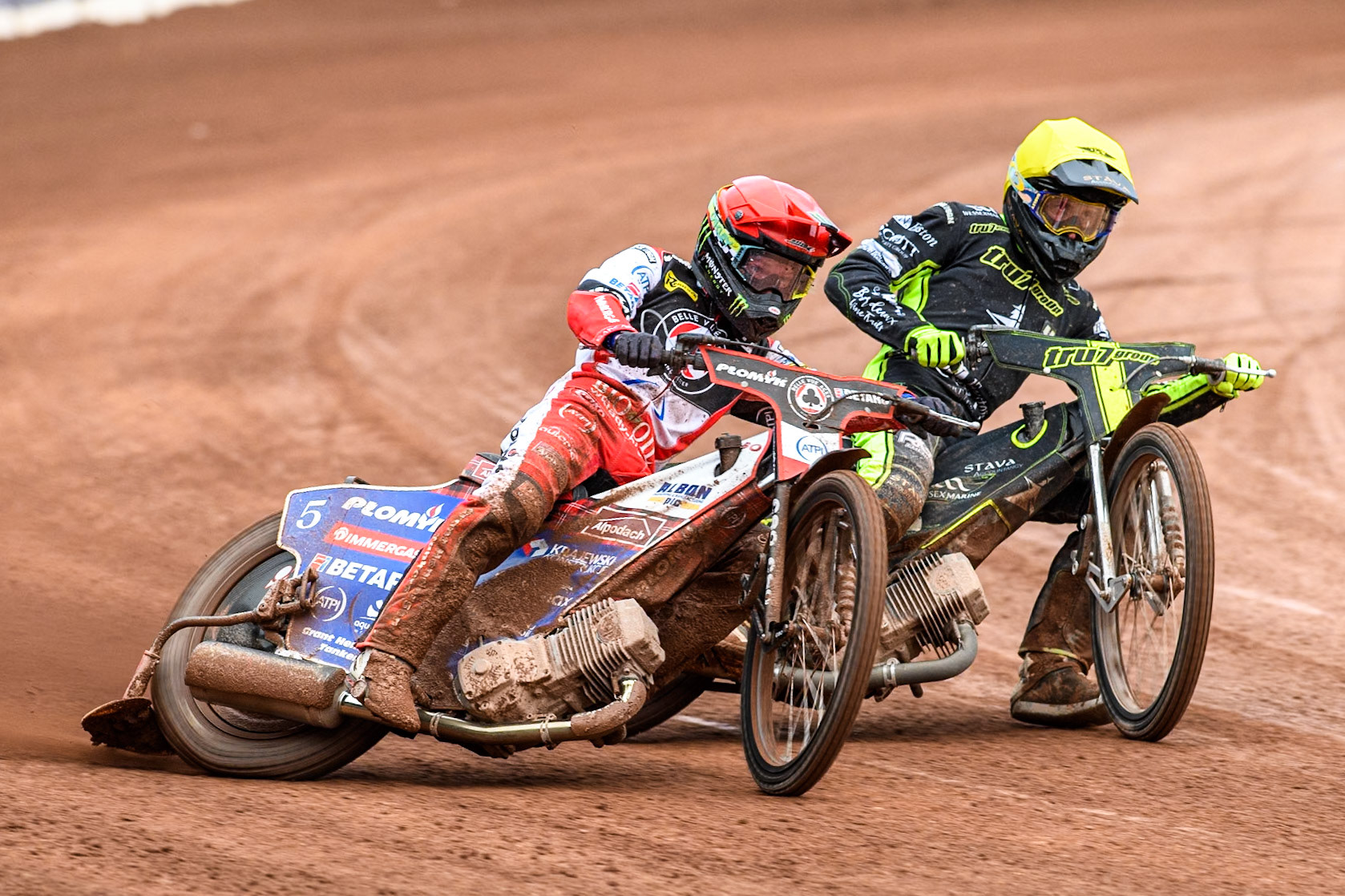 Belle Vue Aces' Dan Bewley  in Red rides outside Ipswich Witches' Adam Ellis in Yellow during the Rowe Motor Oil Premiership match between Belle Vue Aces and Ipswich Witches at the National Speedway Stadium, Manchester on Monday 1st July 2024. (Photo: Ian Charles | MI News)