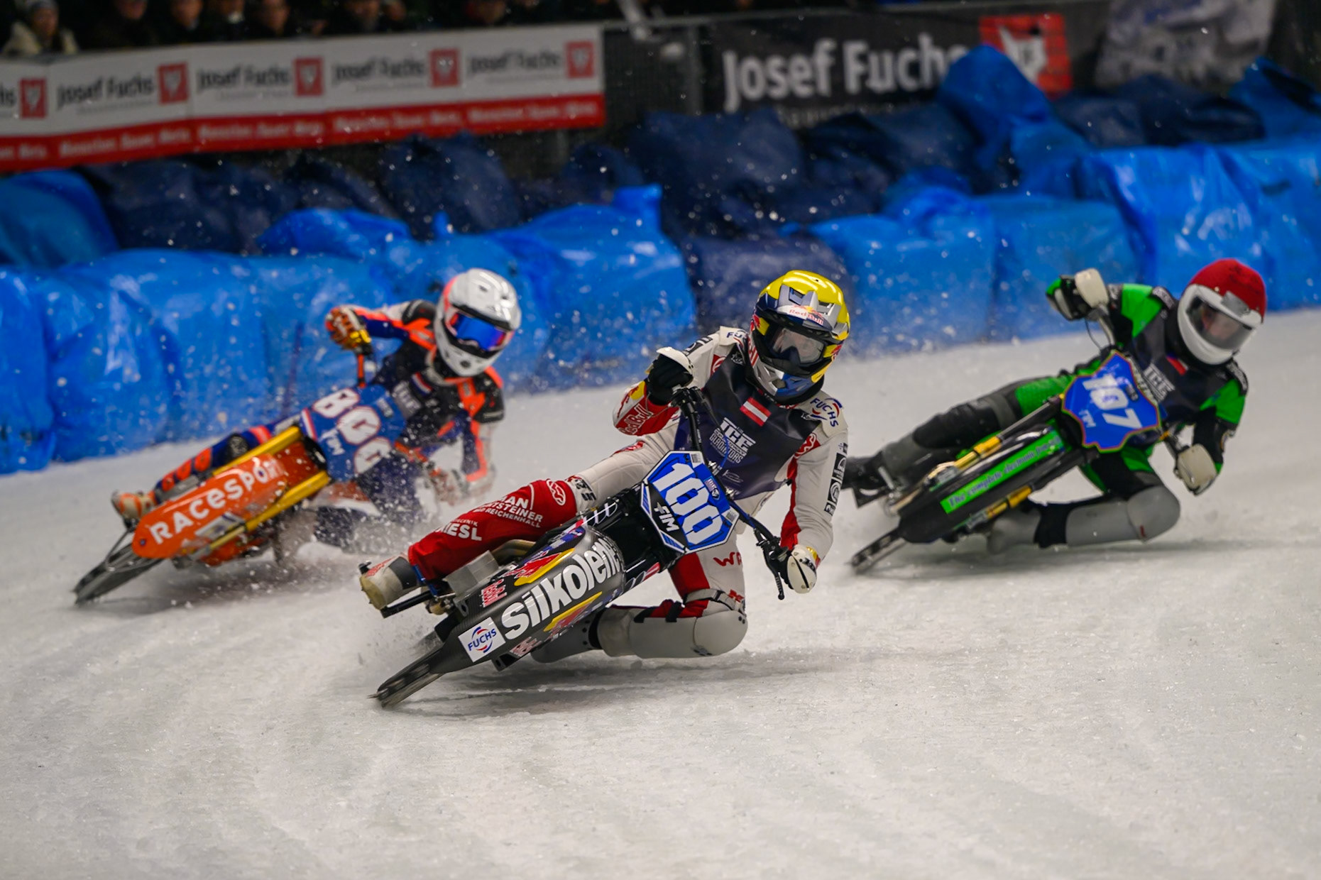Franz Zorn (100) of Austria  in Yellow leading Jasper Iwema (800) of The Netherlands  in White and Andrej Divis (107) of Czechia  in Red during the Ice Speedway Gladiators World Championship Final 1 at Max-Aicher-Arena, Inzell on Saturday 14th March 2026. (Photo: Ian Charles | MI News)