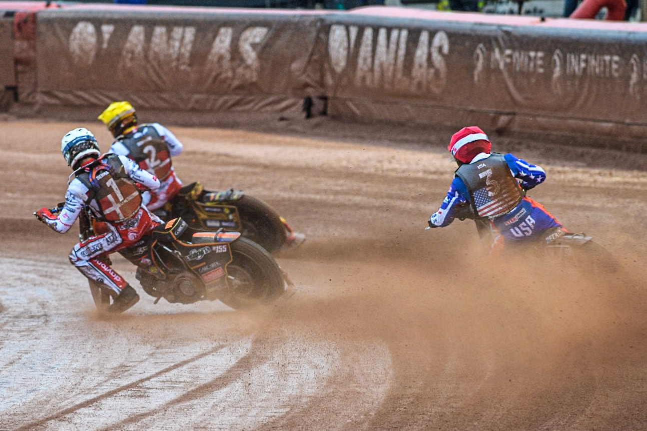 Mikkel Michelsen of Denmark in White passes Broc Nicol of the USA in Red with Anders Thomsen of Denmark in Yellow leading during the Monster Energy FIM Speedway of Nation Semi Final 2 at the National Speedway Stadium, Manchester on Wednesday 10th July 2024. (Photo: Ian Charles | MI News)