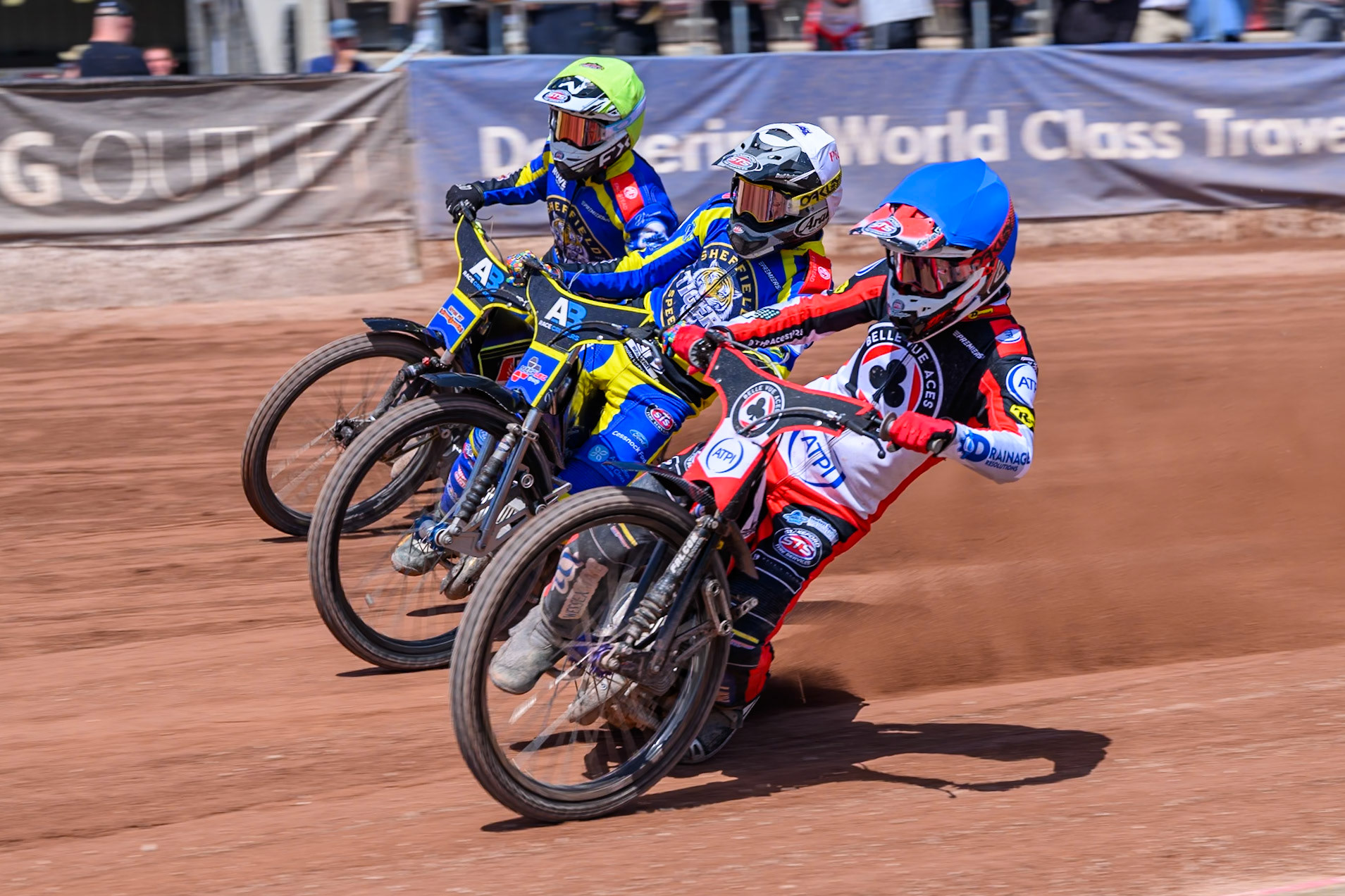 Zach Cook of Belle Vue Aces  in Blue rides inside Josh Pickering of Sheffield Tigers  in White and Jye Etheridge of Sheffield Tigers  in Yellow during the Rowe Motor Oil Premiership match between Belle Vue Aces and Sheffield Tigers at the National Speedway Stadium, Manchester on Monday 25th May 2026. (Photo: Ian Charles | MI News)