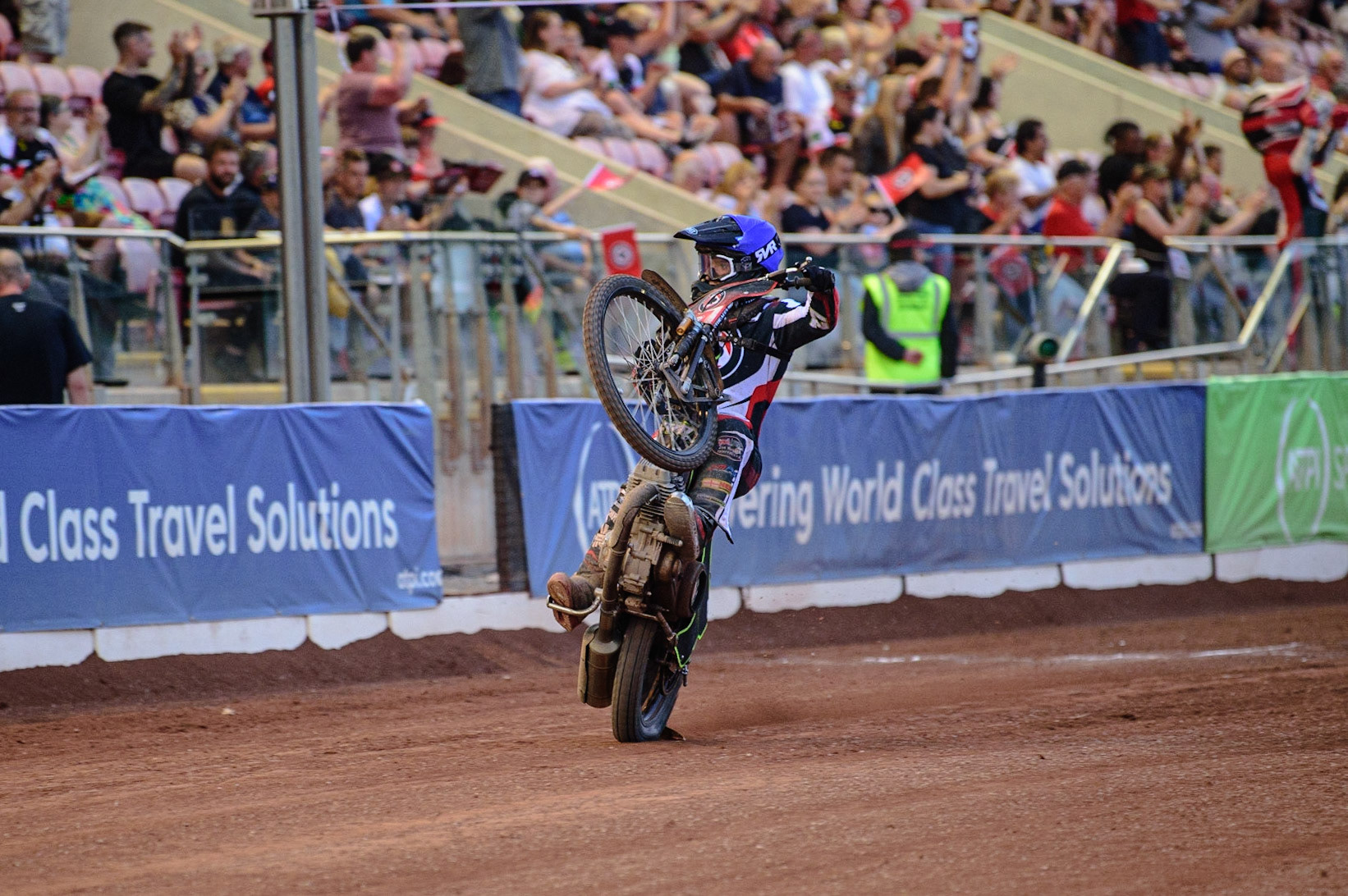 MANCHESTER UK  Tom Brennan  celebrates with a wheelie during the SGB Premiership match between Belle Vue Aces and King's Lynn Stars at the National Speedway Stadium, Manchester on Monday 11th July 2022. (Credit: Ian Charles | MI News)