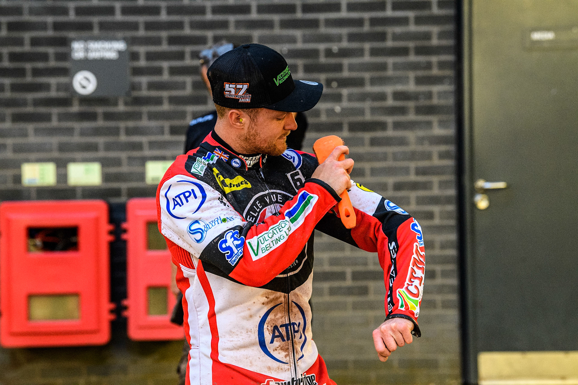 Belle Vue Aces' Connor Mountain cleans the dirt off his kevlars during the Rowe Motor Oil Premiership match between Belle Vue Aces and Oxford Spires at the National Speedway Stadium, Manchester on Monday 13th May 2024. (Photo: Ian Charles | MI News)