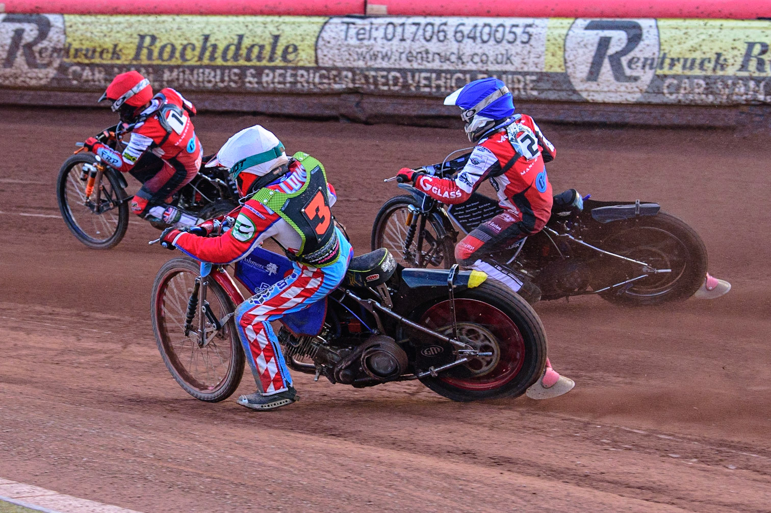 Jacob Fellows  (White) chases Jack Smith  (Red) and Sam McGurk  (Blue) during the National Development League match between Belle Vue Colts and Mildenhall Fens Tigers at the National Speedway Stadium, Manchester on Friday 15th July 2022. (Credit: Ian Charles | MI News)