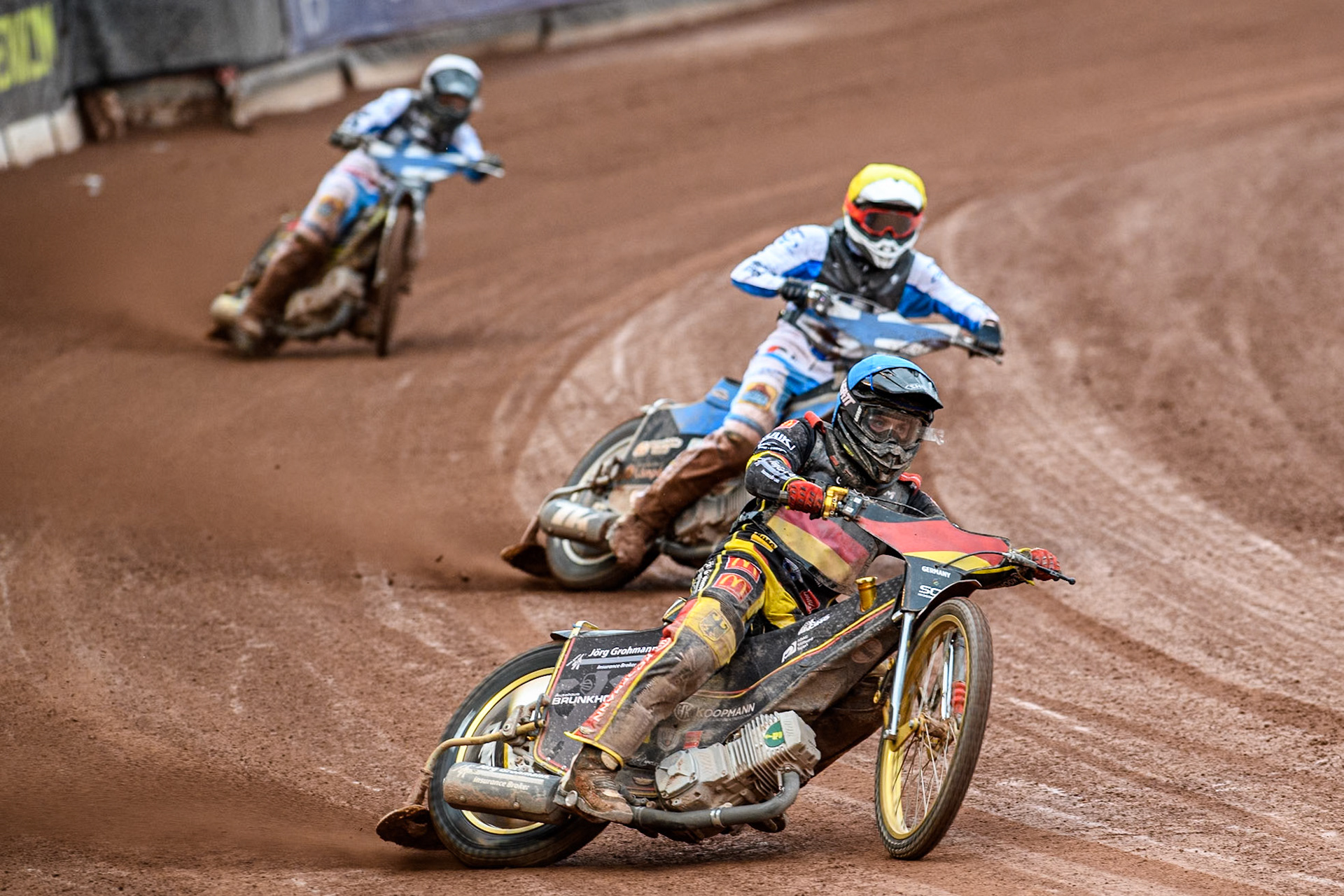 Norick Blödorn of Germany in Blue leading \Antti Vuolas of Finland in Yellow and Jesse Mustonen of Finland in White during the Monster Energy FIM Speedway of Nations Semi-Final 1 at the National Speedway Stadium, Manchester on Tuesday 9th July 2024. (Photo: Ian Charles | MI News)