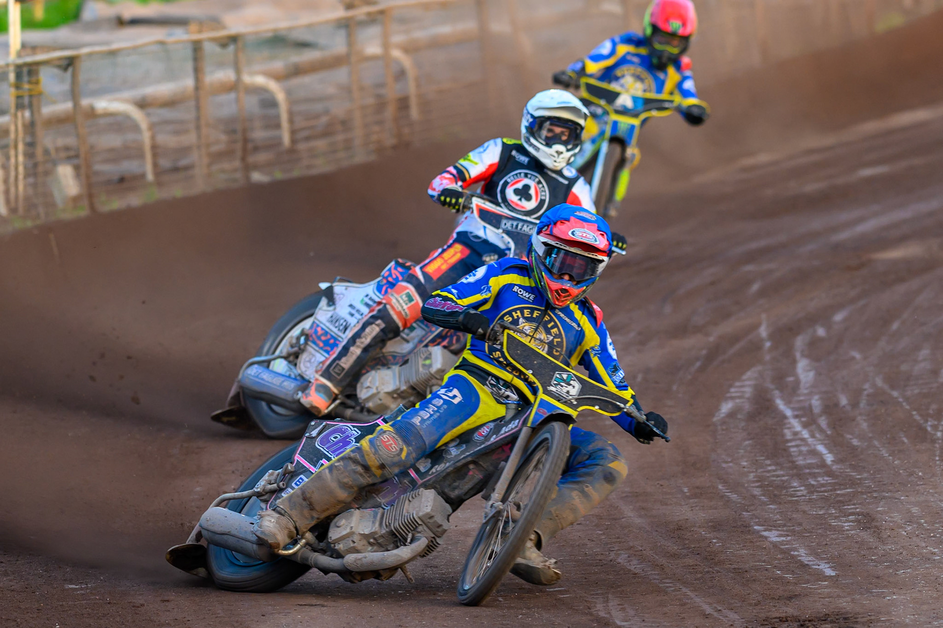Leon Flint of Sheffield Tigers in Blue leading Niels-Kristian Iversen, Guest Rider for Belle Vue Aces in White and Chris Holder of Sheffield Tigers in Red during the Rowe Motor Oil Premiership match between Sheffield Tigers and Belle Vue Aces at Owlerton Stadium, Sheffield on Monday 25th May 2026. (Photo: Ian Charles | MI News)