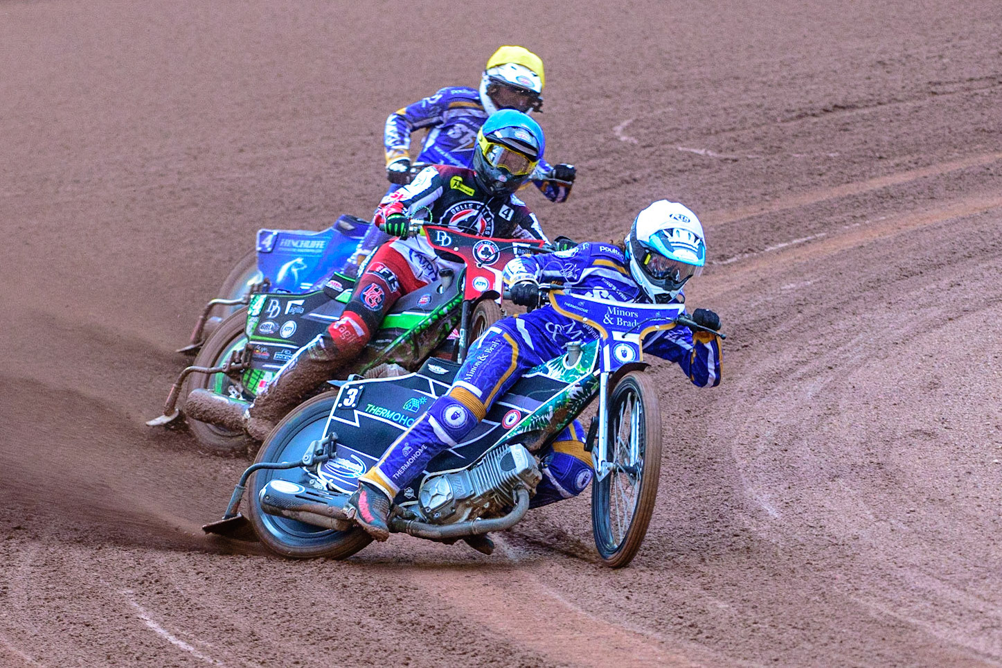MANCHESTER, UK. MAY 16TH Richard Lawson  (White) leads Charles Wright  (Blue) and Lewis Kerr  (Yellow) during the SGB Premiership match between Belle Vue Aces and King's Lynn Stars at the National Speedway Stadium, Manchester on Monday 16th May 2022. (Credit: Ian Charles | MI News)