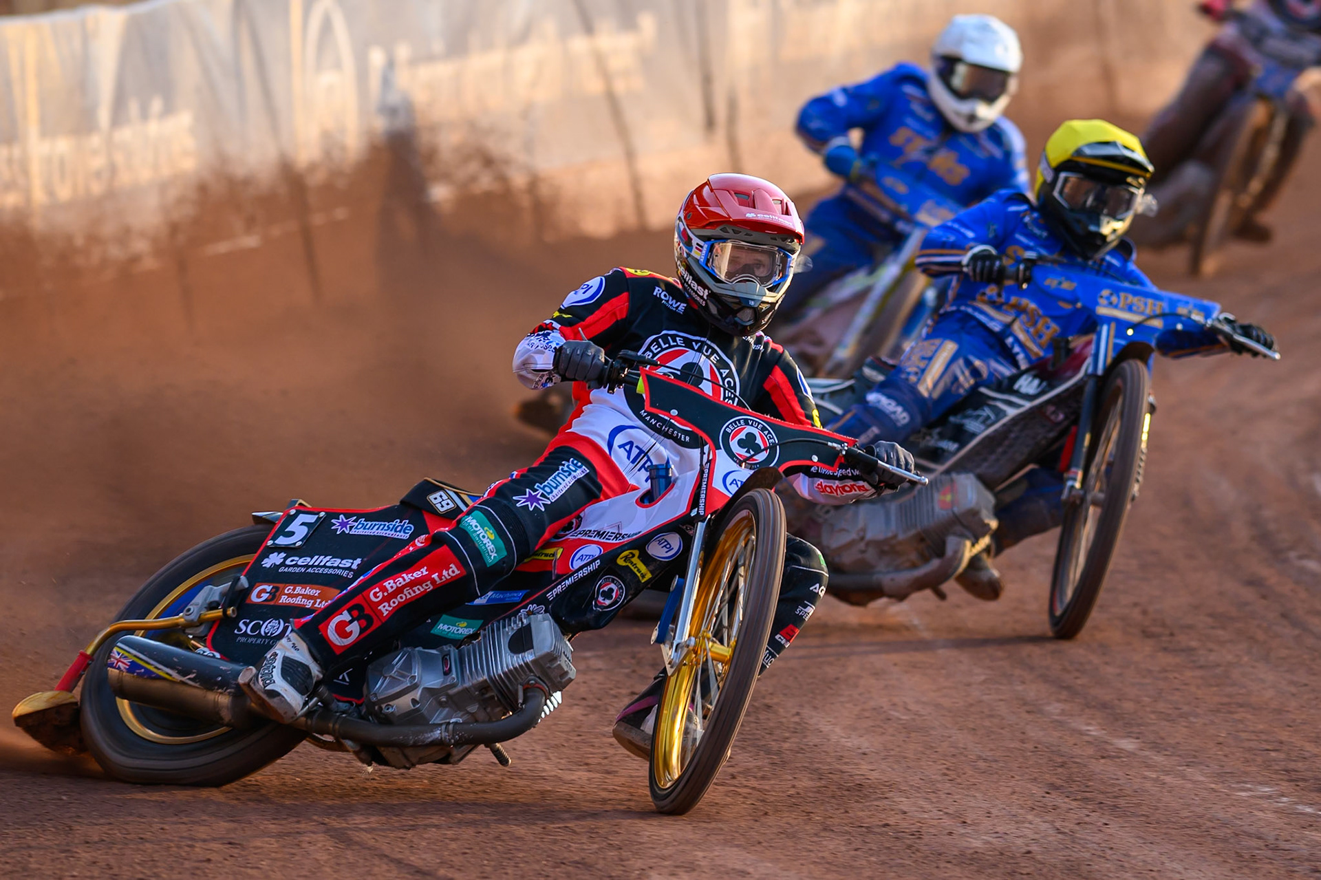 Jason Doyle of Belle Vue Aces in Red leading Ben Cook of Kings Lynn Stars in Yellow and Chris Harris of Kings Lynn Stars in White during the Rowe Motor Oil Premiership match between Belle Vue Aces and King's Lynn Stars at the National Speedway Stadium, Manchester on Monday 10th August 2026. (Photo: Ian Charles | MI News)