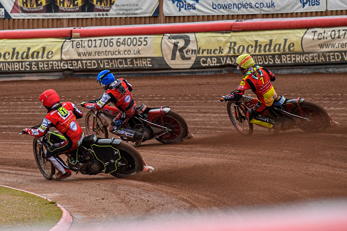 Tom Brennan (Red) and Connor Bailey (Blue) inside Drew Kemp (Yellow) during the Sports Insure Premiership match between Belle Vue Aces and Leicester Lions at the National Speedway Stadium, Manchester on Monday 28th August 2023. (Photo: Ian Charles | MI News)