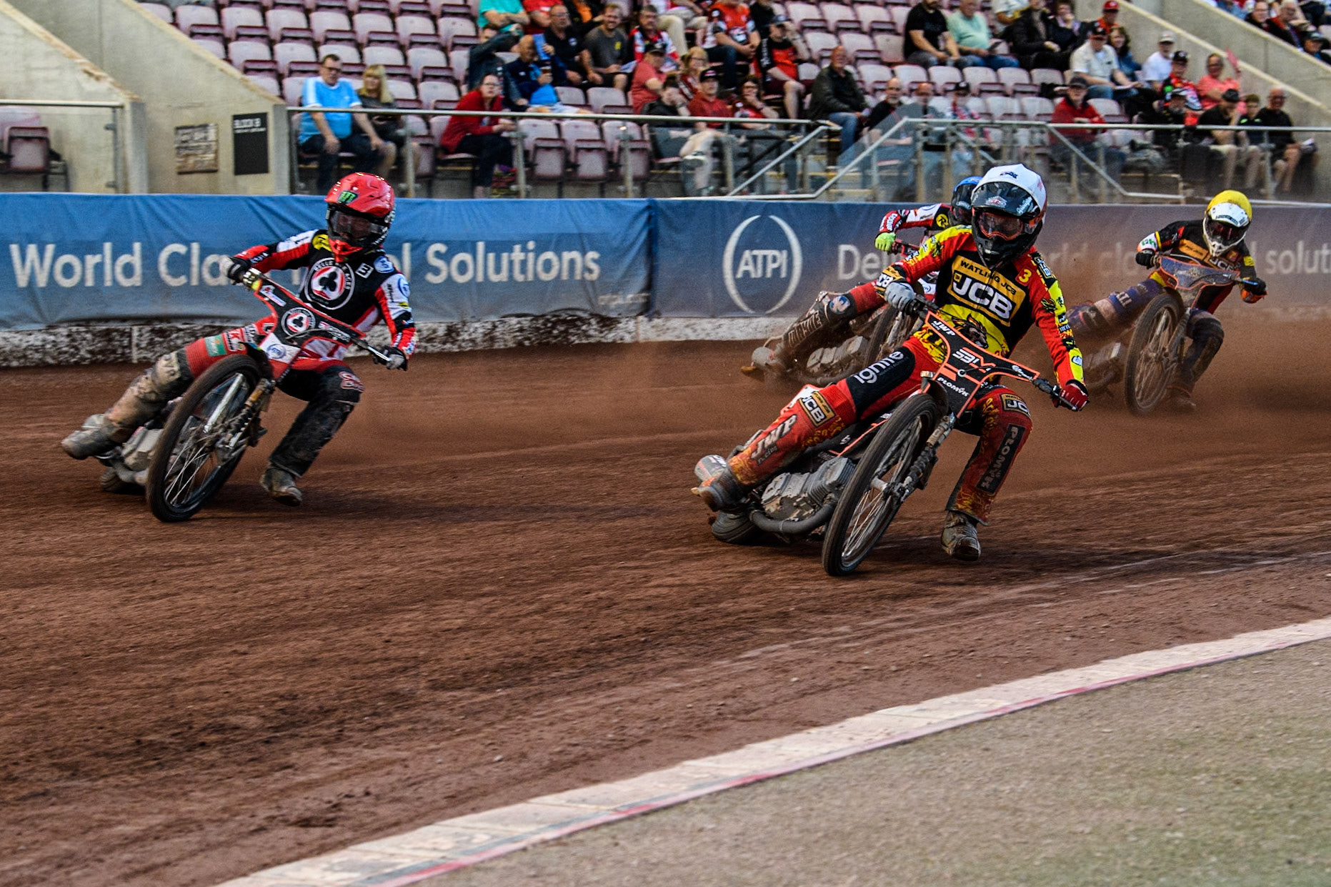 Leicester Lions' Sam Masters in White rides inside Belle Vue Aces' Jaimon Lidsey in Red with Belle Vue Aces' Connor Bailey in Blue and Leicester Lions' Guest rider Luke Killeen in Yellow behind during the Rowe Motor Oil Premiership match between Belle Vue Aces and Leicester Lions at the National Speedway Stadium, Manchester on Monday 24th June 2024. (Photo: Ian Charles | MI News)