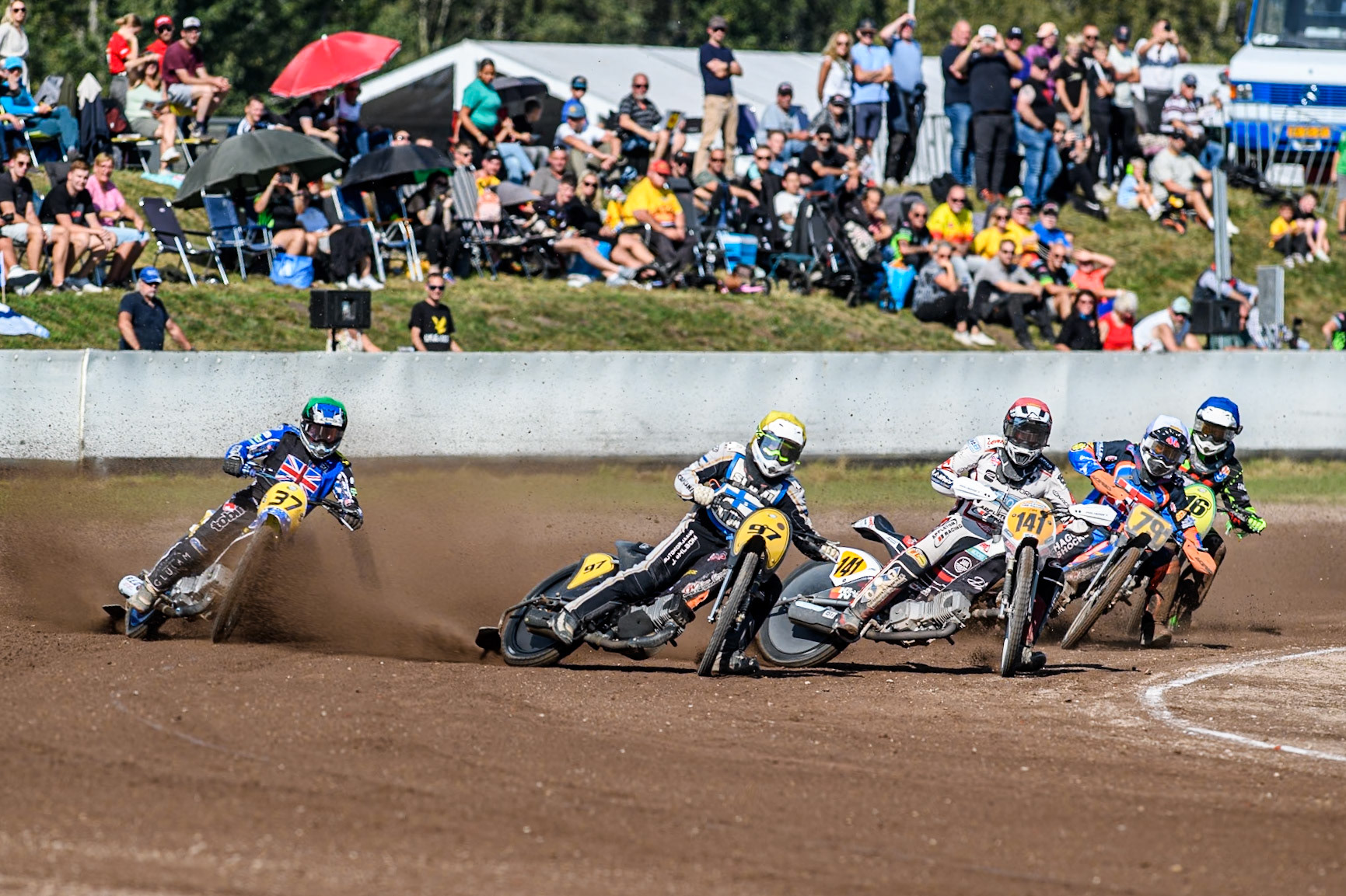 Andrew Appleton (141) of Great Britain in Red leading Henri Ahlbom (97) of Finland in Yellow Jacob Bukhave (79) of Denmark in White Chris Harris (37)of Great Britain in Green  and Nigel Hummel of The Netherlands in Blue during the FIM Long Track World Championship Final 5 at the Speed Centre Roden, Roden, Netherlands on Sunday 22nd September 2024. (Photo: Ian Charles | MI News)