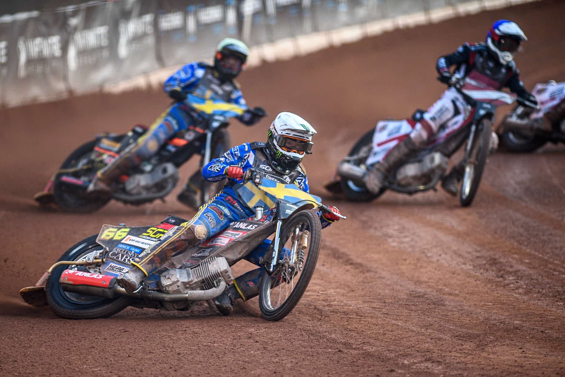 SWEDEN v LATVIA: Fredrik Lindgren of Sweden in White leading Jacob Thorssell of Sweden in Yellow and Daniils Kolodinskis of Latvia in Blue during the Monster Energy FIM Speedway of Nation Final at the National Speedway Stadium, Manchester on Saturday 13th July 2024. (Photo: Ian Charles | MI News)