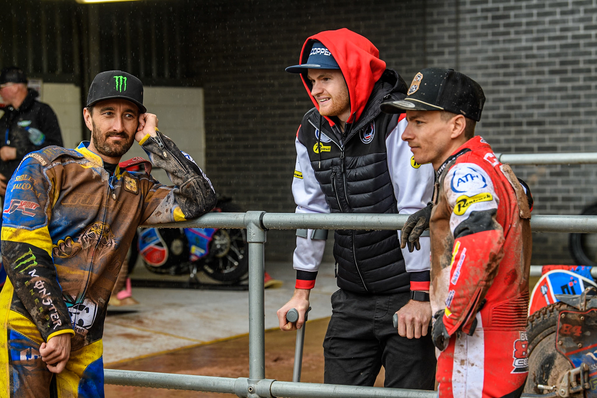 (L to R) Chris Holder, Belle Vue Aces injured rider Brady Kurtz and Belle Vue Aces' Ben Cook during the Rowe Motor Oil Premiership match between Belle Vue Aces and Sheffield Tigers at the National Speedway Stadium, Manchester on Monday 27th May 2024. (Photo: Ian Charles | MI News)
