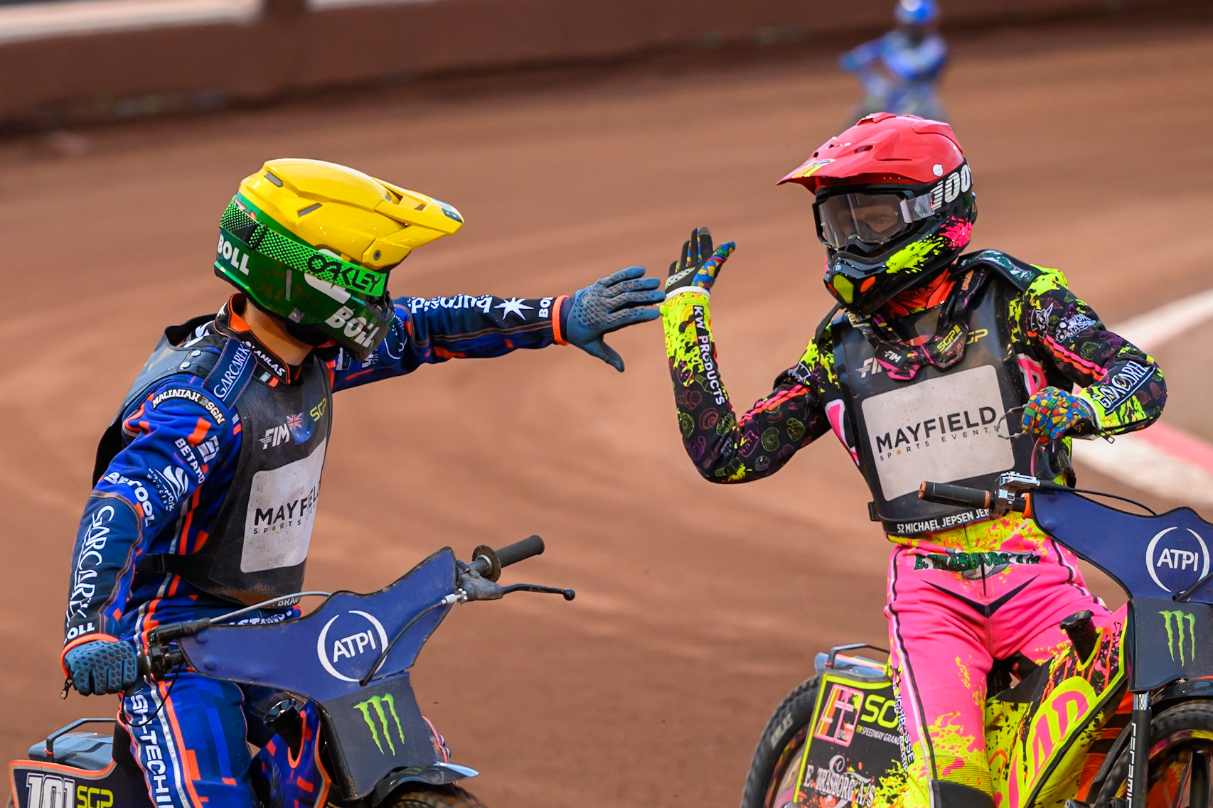Michael Jepsen Jensen (52) of Denmark in Red congratulates Brady Kurtz (101) of Australia in Yellow during the ATPI  FIM Speedway GP of Manchester at the National Speedway Stadium, Manchester on Saturday 6th June 2026. (Photo: Ian Charles | MI News)