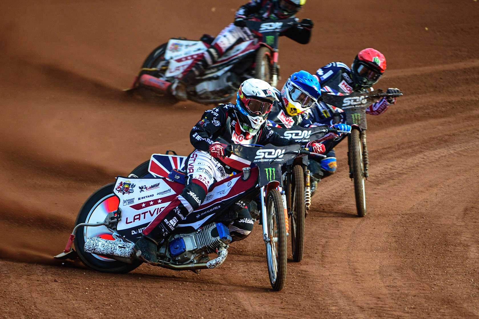 MANCHESTER, UK. OCT 16TH Andzejs Lebedevs of Latvia (White) leads Robert Lambert of Great Britain (Blue), Tai Woffinden of Great Britain (Red) and Olegs Mijailovs of Latvia (Yellow) during the Monster Energy FIM Speedway of Nations at the National Speedway Stadium, Manchester on Saturday  16th October 2021. (Credit: Ian Charles | MI News)