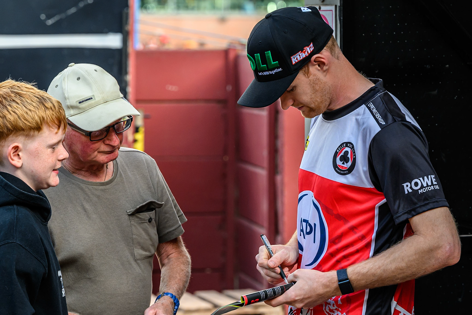 Belle Vue Aces' Brady Kurtz signs an autograph for a fanduring the Rowe Motor Oil Premiership match between Birmingham Brummies and Belle Vue Aces at Perry Barr Stadium, Birmingham on Monday 28th July 2025. (Photo: Ian Charles | MI News)