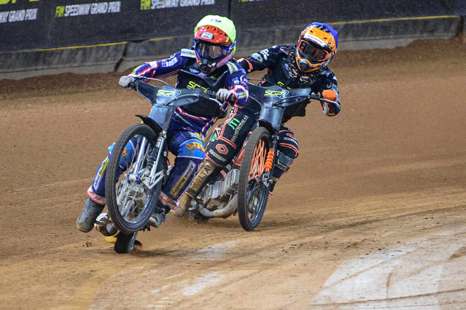 Leon Flint (Great Britain)  (Yellow) picks up some drive coming out of the corner ahead of Kevin Juhl Pedersen (Denmark) (Blue) during the FIM  Speedway Grand Prix  2 of Great Britain at the Principality Stadium, Cardiff on Sunday 14th August 2022. (Credit: Ian Charles | MI News)