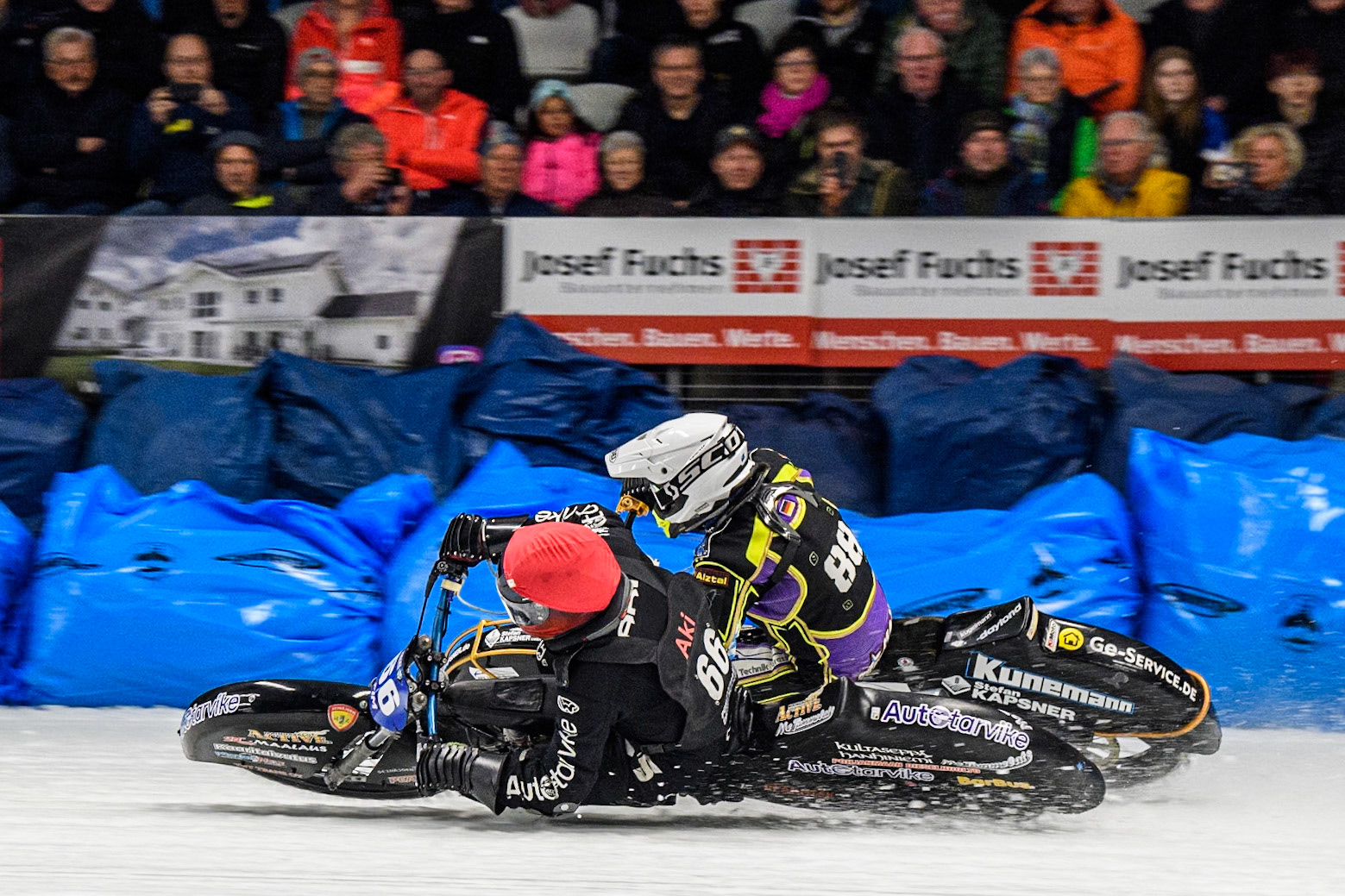 Aki Ala-Riihimäki (66) of Finland in Red rides inside Max Niedermaier  (88) of Germany in White during the Ice Speedway Gladiators World Championship Final 1 at Max-Aicher-Arena, Inzell on Saturday 15th March 2025. (Photo: Ian Charles | MI News)