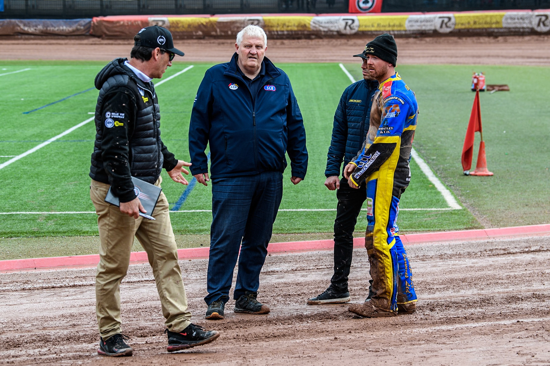 On track meeting with (L to R) Belle Vue Aces' Team Manager Mark Lemon, Referee Dave Watters, Sheffield Tigers' Team Manager Simon Stead and Sheffield Tigers' Kyle Howarthduring the Rowe Motor Oil Premiership match between Belle Vue Aces and Sheffield Tigers at the National Speedway Stadium, Manchester on Monday 27th May 2024. (Photo: Ian Charles | MI News)