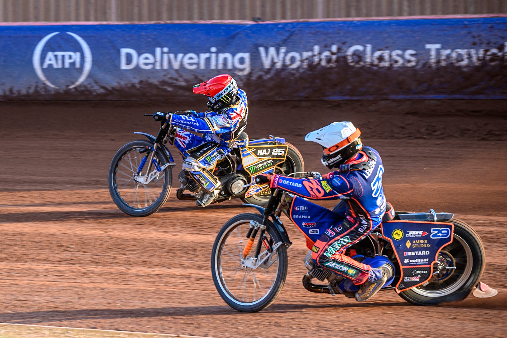 Andzejs Lebedevs (29) of Latvia in White chases Jack Holder (25) of Australia in Red during the ATPI FIM Speedway Grand Prix Round 5 at the National Speedway Stadium, Manchester, on Saturday 14th June 2025. (Photo: Ian Charles | MI News)