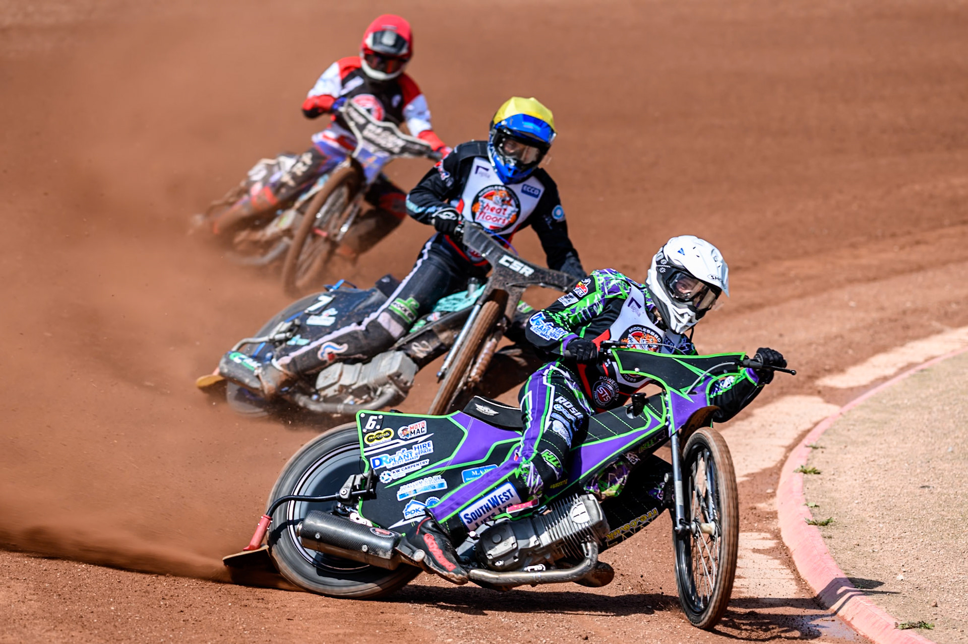 Kai Ward of Middlesborough Tigers  in White leading Charlie Southwick of Middlesborough Tigers  in Yellow and Harry Fletcher of Belle Vue Colts  in Red during the WSRA National Development League match between Belle Vue Colts and Middlesbrough Tigers at the National Speedway Stadium, Manchester on Sunday 10th August 2025. (Photo: Mark Fletcher | MI News)