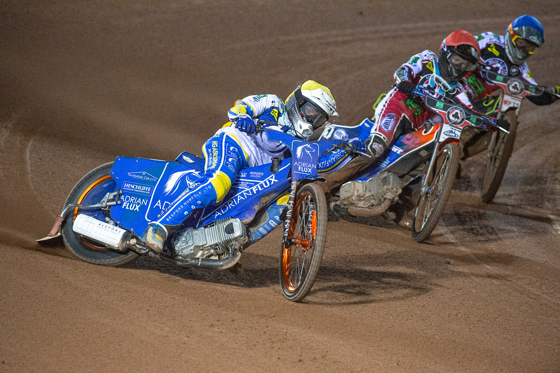 Photo: Ian CharlesLewis Kerr of the 'ATPI' All Stars (Yellow) takes the lead from Brady Kurtz of Belle Vue 'BikeRight' Aces (Red) and Jye Etheridge of Belle Vue 'BikeRight' Aces  (Blue)Belle Vue ‘Bikerite ’Aces v ‘ATPI’ All Stars, Premiership Challenge, National Speedway Stadium, Manchester Thursday  24  September  2020