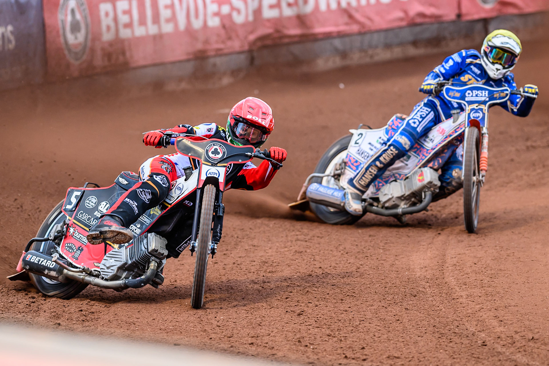 Belle Vue Aces' Brady Kurtz in Red leading Kings Lynn Stars' Niels-Kristian Iversen in Yellow during the Rowe Motor Oil Premiership match between Belle Vue Aces and King's Lynn Stars at the National Speedway Stadium, Manchester on Monday 23rd June 2025. (Photo: Ian Charles | MI News)