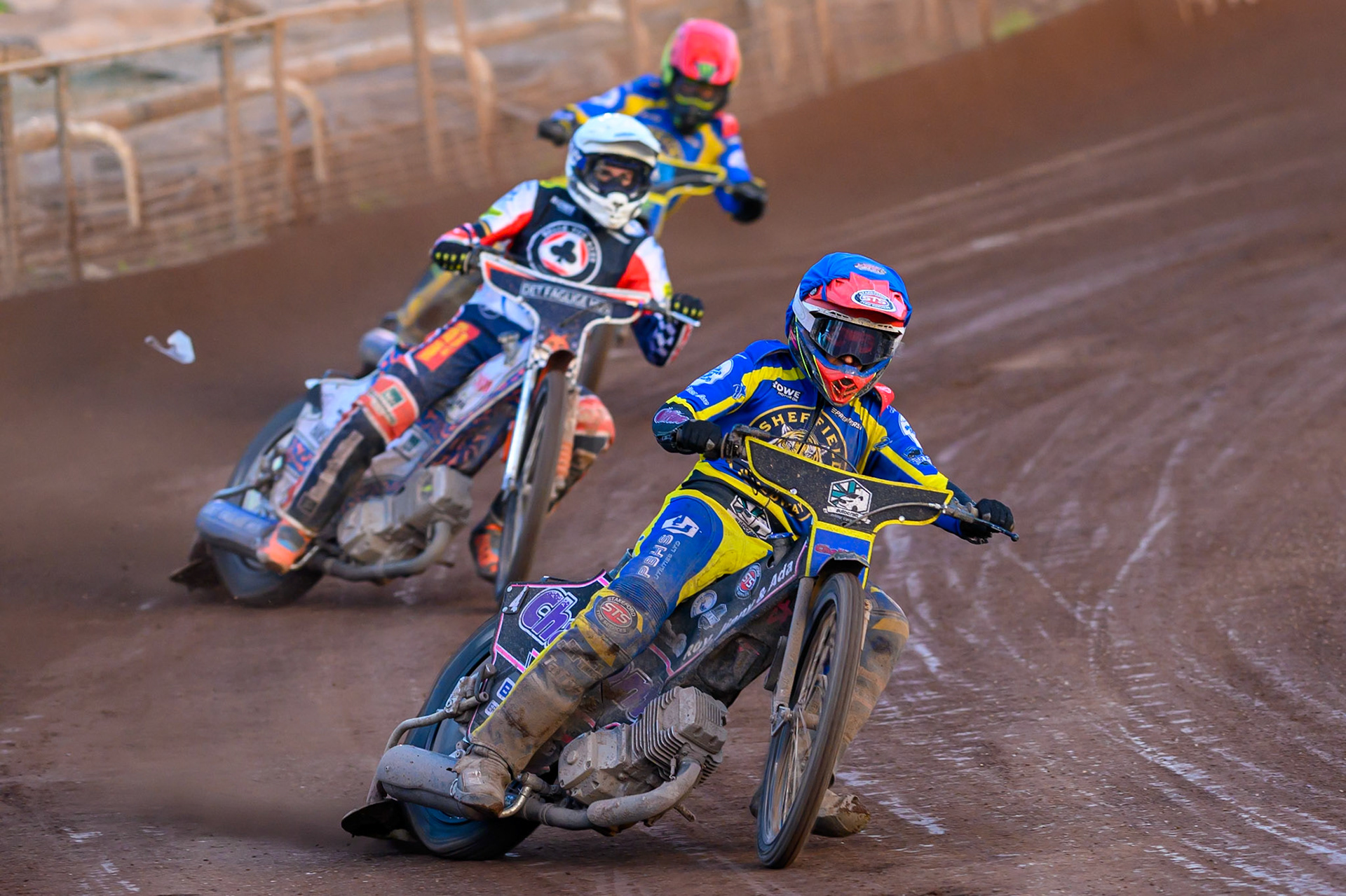Leon Flint of Sheffield Tigers in Blue leading Niels-Kristian Iversen, Guest Rider for Belle Vue Aces in White and Chris Holder of Sheffield Tigers in Red during the Rowe Motor Oil Premiership match between Sheffield Tigers and Belle Vue Aces at Owlerton Stadium, Sheffield on Monday 25th May 2026. (Photo: Ian Charles | MI News)