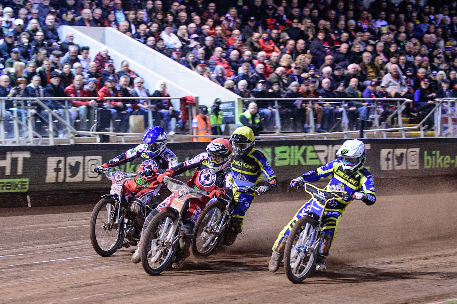 MANCHESTER, UK. OCT 7TH  The final heat as Dan Bewley  (Red) and Richie Worrall  (Blue) leads Jack Holder  (White) and Adam Ellis  (Yellow) during the SGB Premiership Play off Semi-Final Second Leg between Belle Vue Aces and Sheffield Tigers at the National Speedway Stadium, Manchester on Thursday 7th October 2021. (Credit: Ian Charles | MI News)