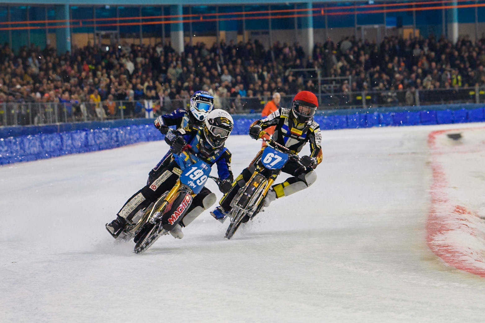 Martin Haarahiltunen (199) of Sweden in White rides outside Heikki Huusko (67) of Finland in Red with Jimmy Hörnell (237) of Sweden in Blue behind during the FIM Ice Speedway Gladiators World Championship, Final 3 at the Ice Stadium, Thialf, Heerenveen on Saturday 5th April 2025. (Photo: Ian Charles | MI News)