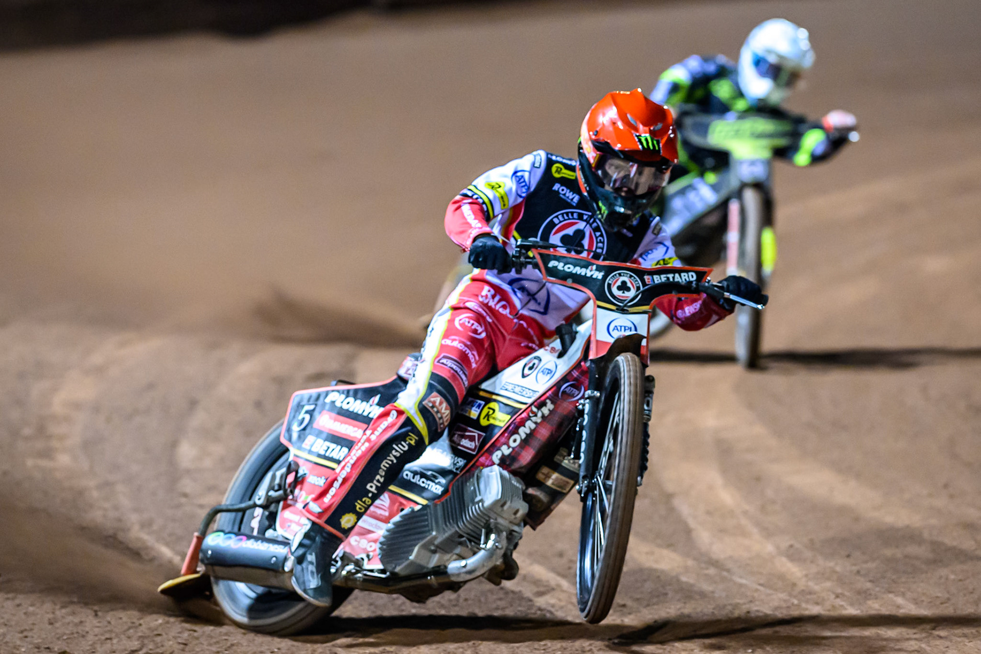 Dan Bewley of Belle Vue Aces  in Red leading Emil Saifutdinov of Ipswich Witches  during the Rowe Motor Oil Premiership Play Off Semi Final 1 (1st Leg)  between Belle Vue Aces and Ipswich Witches at the National Speedway Stadium, Manchester on Monday 8th September 2025. (Photo: Ian Charles | MI News)