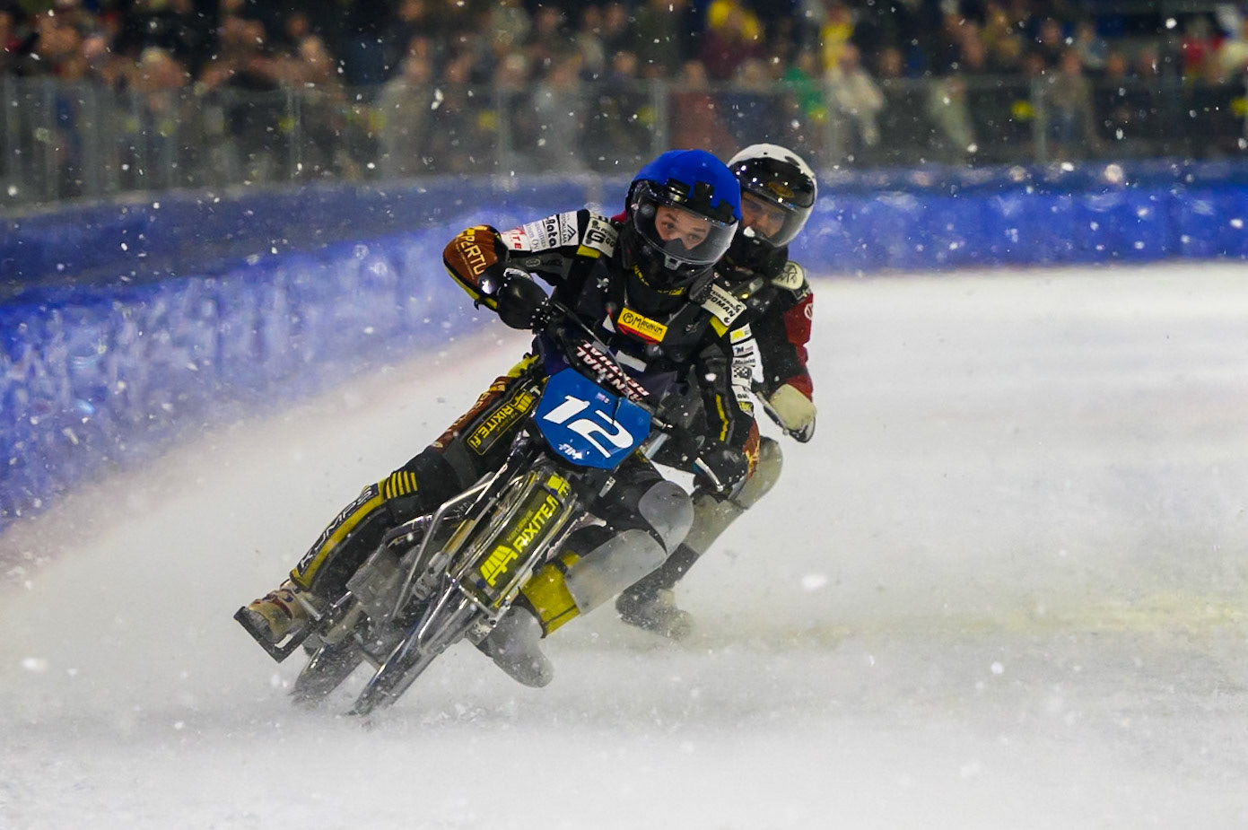 Heikki Huusko (12) of Finland  in Blue leading Ove Ledstrom (2) of Sweden  in White during the FIM Ice Speedway Of Nations at Ice Rink Thialf, Heerenveen on Sunday 12th April 2026. (Photo: Ian Charles | MI News)
