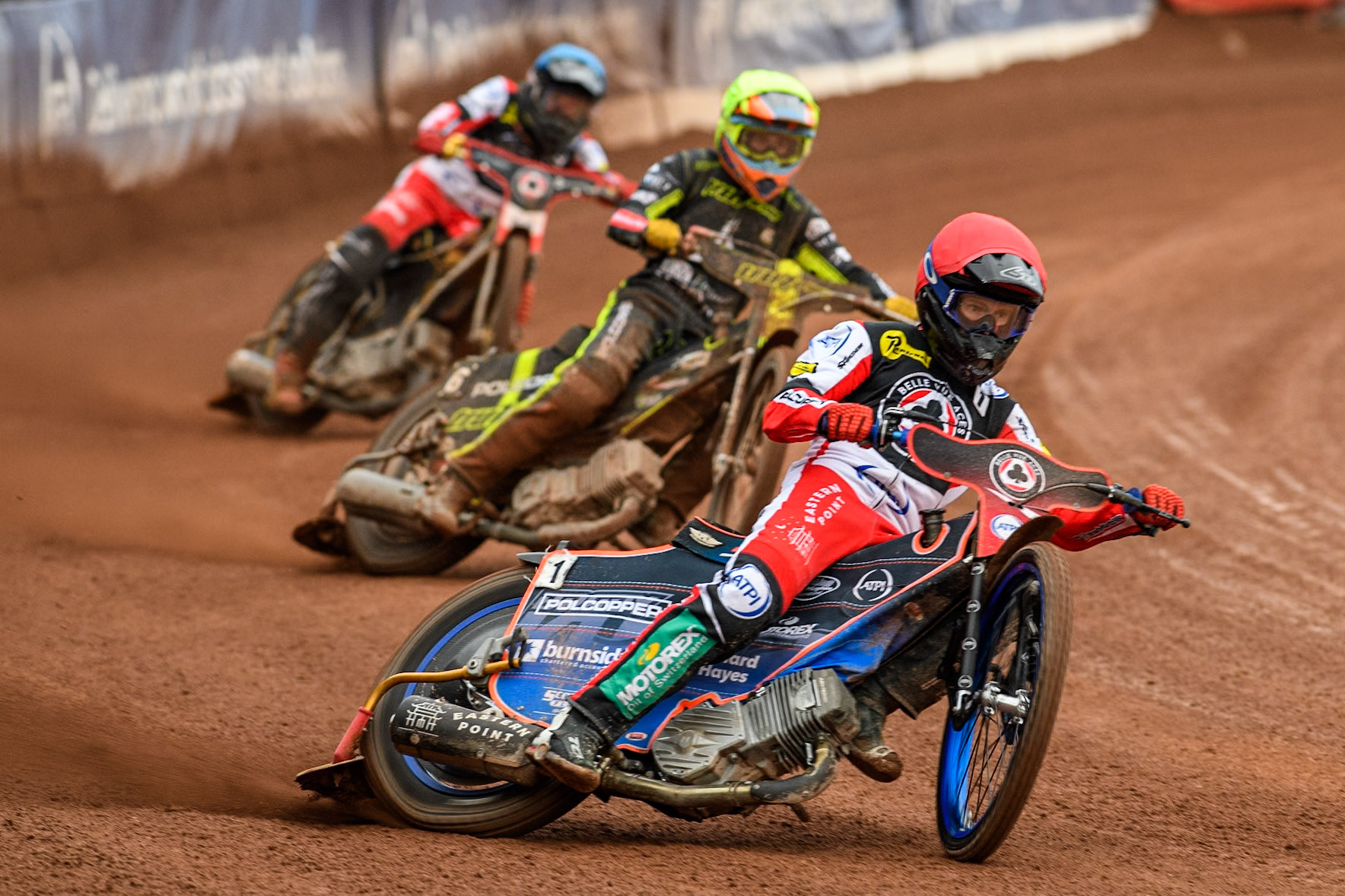 Belle Vue Aces' Brady Kurtz  in Red leading Ipswich Witches' Keynan Rew in Yellow and Belle Vue Aces' Norick Blodorn  in Blue during the Rowe Motor Oil Premiership match between Belle Vue Aces and Ipswich Witches at the National Speedway Stadium, Manchester on Monday 1st July 2024. (Photo: Ian Charles | MI News)