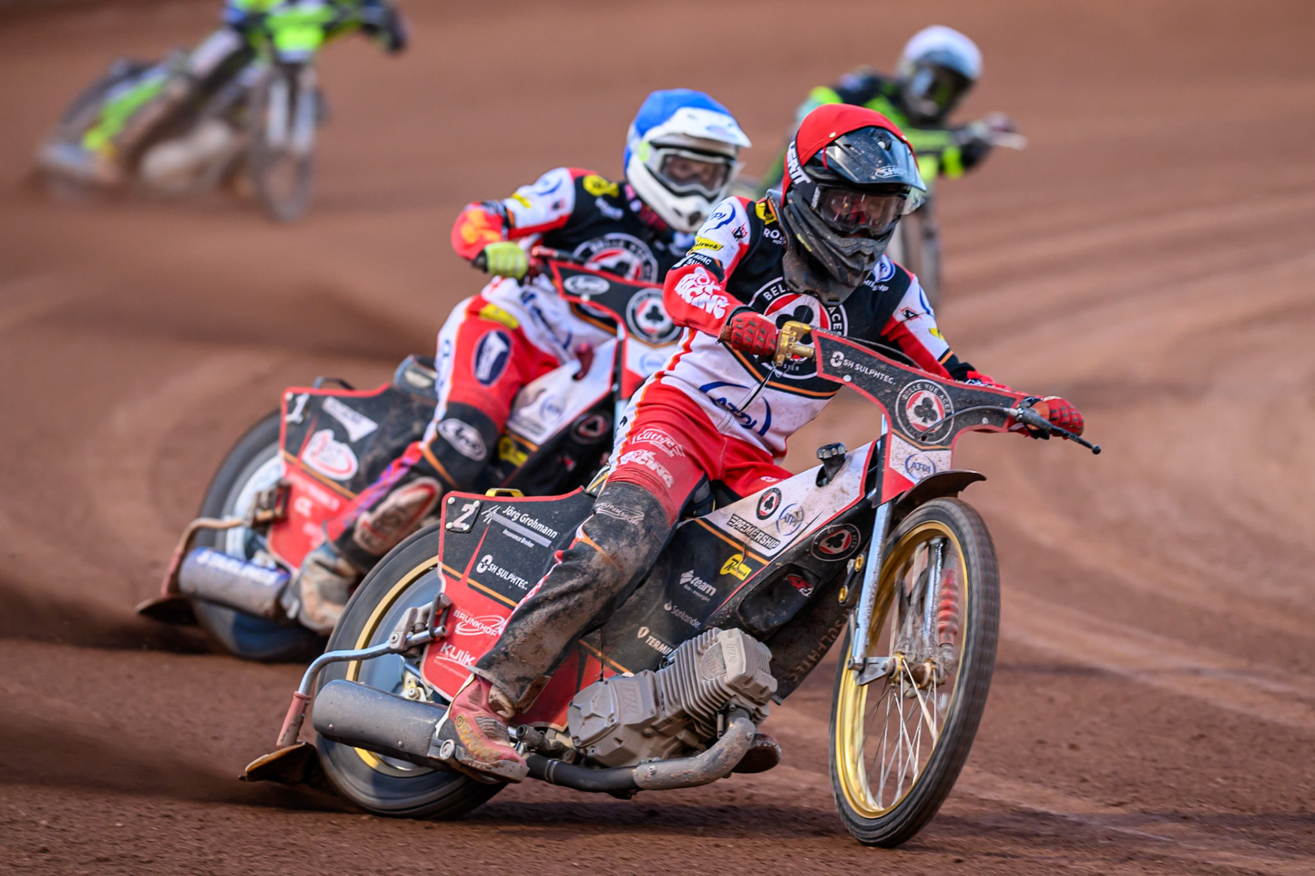 Norick Blödorn of Belle Vue Aces  in Red leading team mate Jake Mulford of Belle Vue Aces  in Blue with Danny King of Ipswich Witches  in White behind  during the Rowe Motor Oil Premiership match between Belle Vue Aces and Ipswich Witches at the National Speedway Stadium, Manchester on Monday 4th August 2025. (Photo: Ian Charles | MI News)