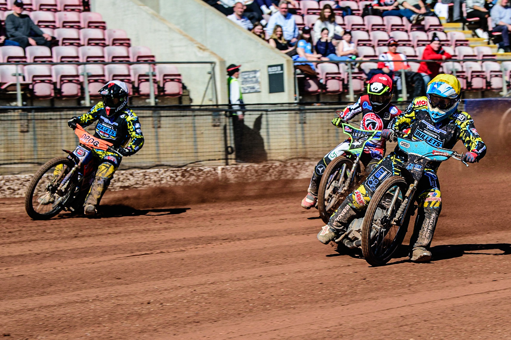 Josh Embleton (White) and team mate Jamie Halder  (Yellow) lead Luke Muff  (Red) during the National Development League match between Belle Vue Colts and Berwick Bullets at the National Speedway Stadium, Manchester on Friday 7th April 2023. (Photo: Ian Charles | MI News)