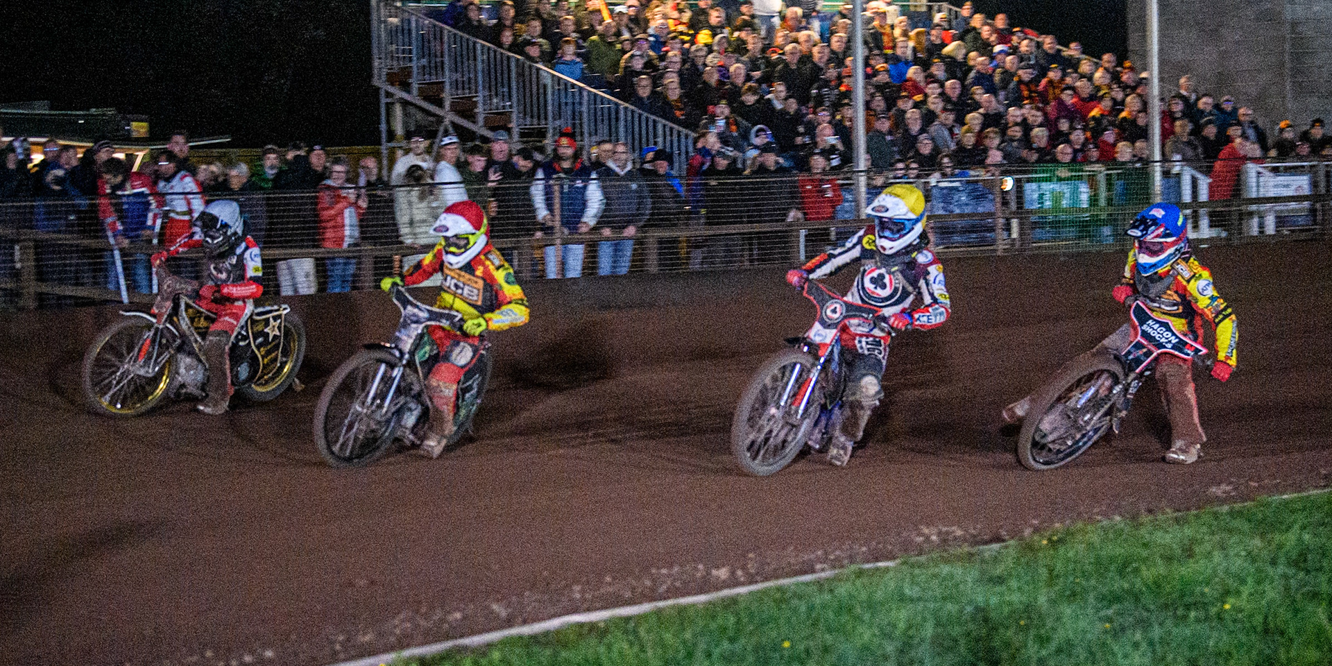 (L to R) Belle Vue Aces' Norick Blodorn in White, Leicester Lions' Richard Lawson in Red, Belle Vue Aces' Jake Mulford in Yellow and Leicester Lions' Sam Hagon in Blue during the Rowe Motor Oil Premiership Grand Final 2nd Leg between Leicester Lions and Belle Vue Aces at the Pidcock Motorcycles Arena, Leicester on Thursday 26th September 2024. (Photo: Ian Charles | MI News)