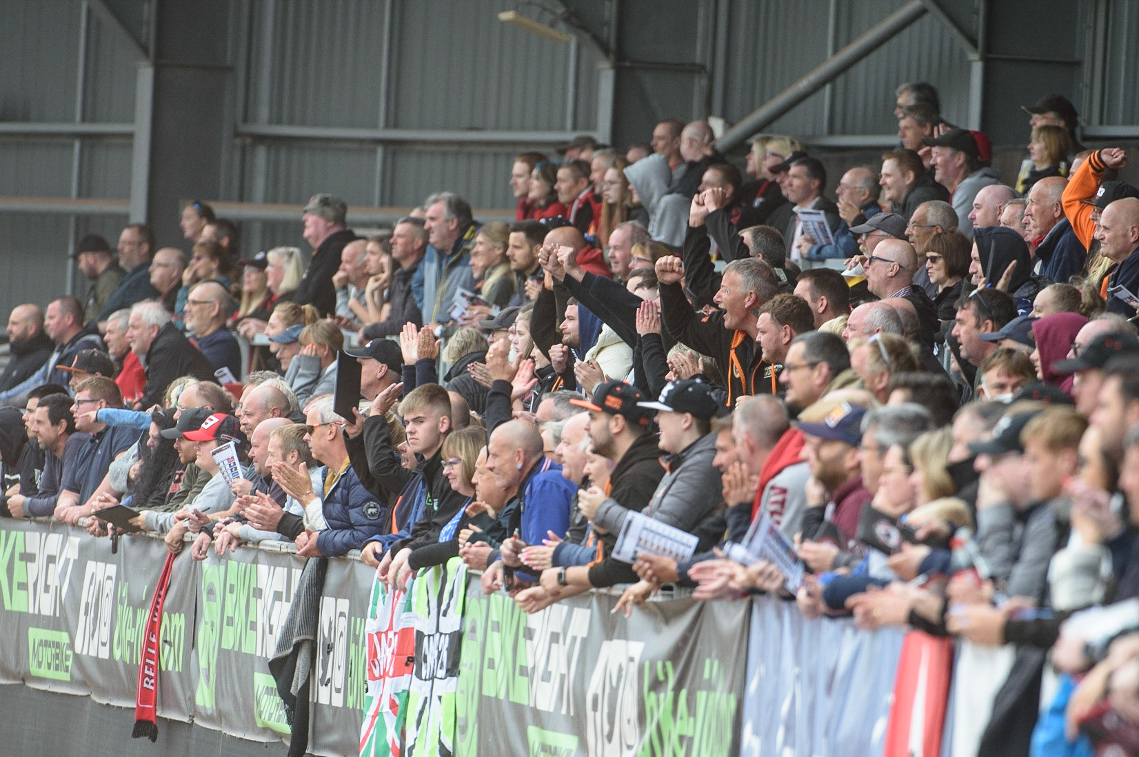 MANCHESTER, UK. AUGUST 30TH Wolves fans on the back straight cheer their riders on during the SGB Premiership match between Belle Vue Aces and Wolverhampton Wolves at the National Speedway Stadium, Manchester on Monday 30th August 2021. (Credit: Ian Charles | MI News)