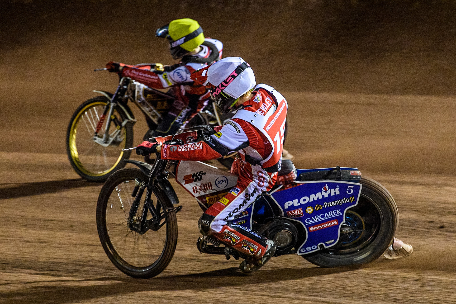 England's Dan Bewley (White) chases Germany's Norick Blödorn (Yellow) during the Peter Craven Memorial Trophy meeting at the National Speedway Stadium, Manchester on Monday 18th March 2024. (Photo: Ian Charles | MI News)