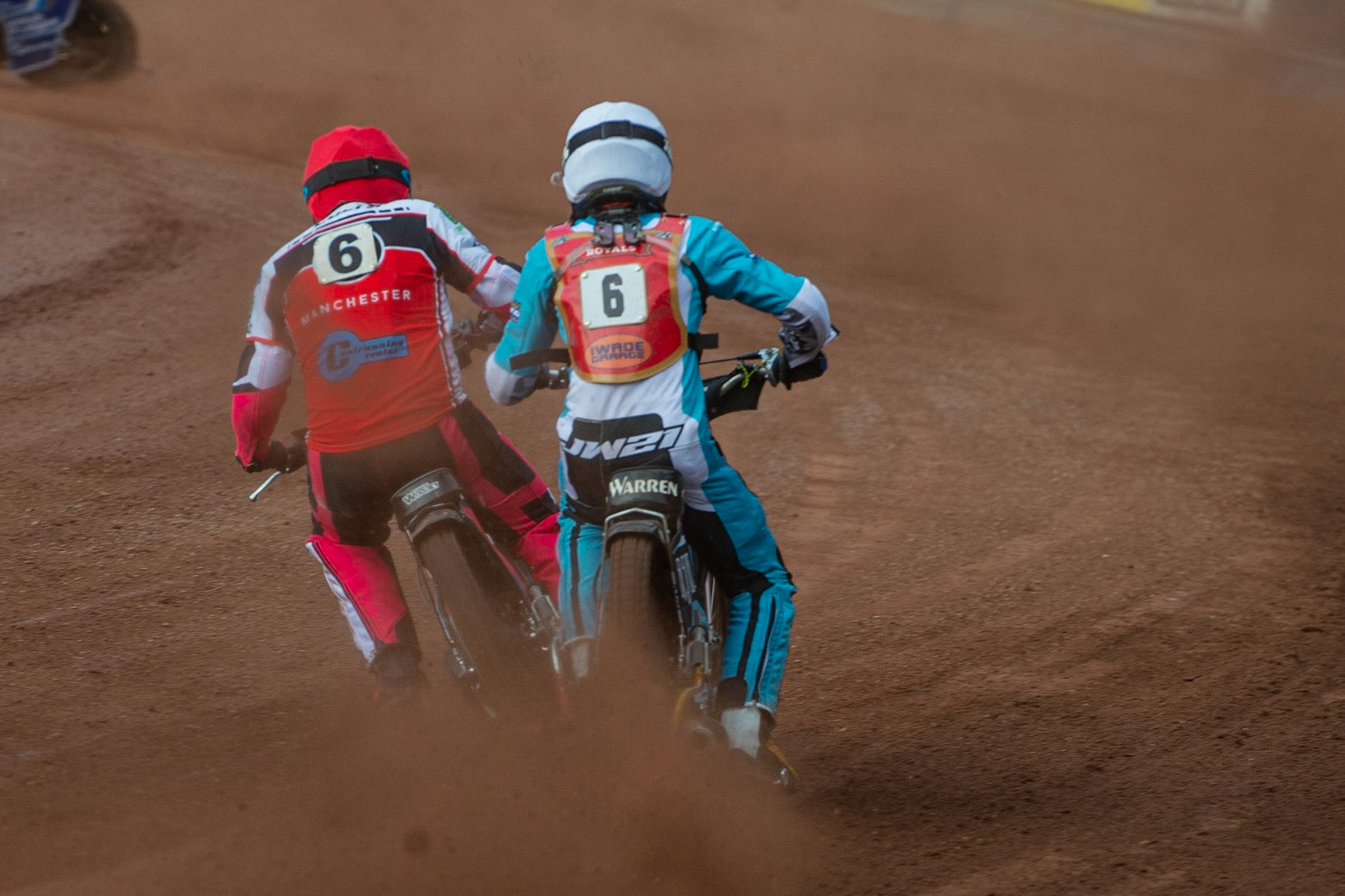 MANCHESTER, UK. JULY 2ND  Sam Woolley  (Red) passes Josh Warren  (White) during the National Development League match between Belle Vue Colts and Kent Royals at the National Speedway Stadium, Manchester on Friday 2nd July 2021. (Credit: Ian Charles | MI News)