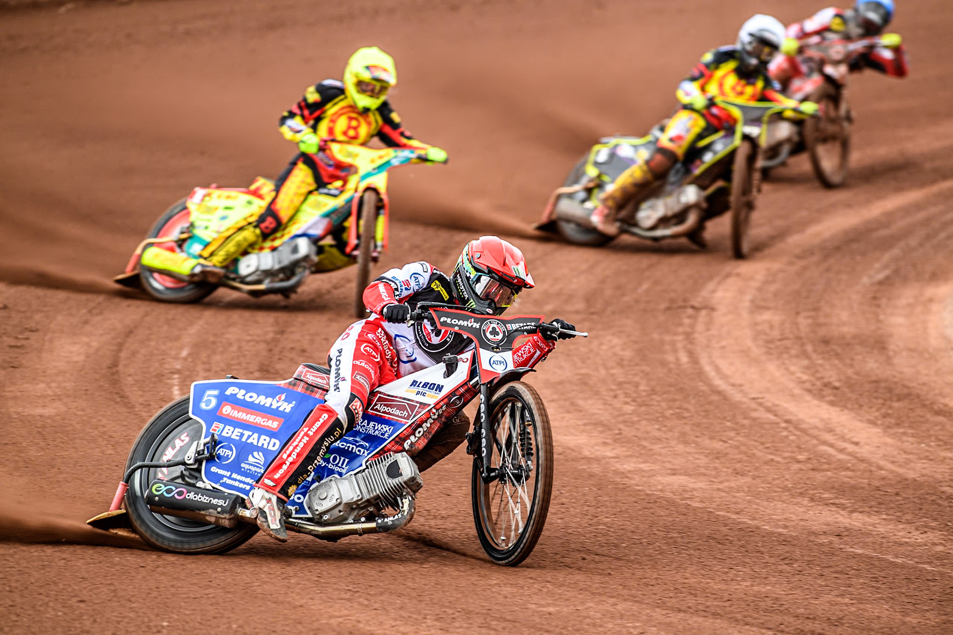 Belle Vue Aces' Dan Bewley  in Red leading Birmingham Brummies' Vaclav Milik  in Yellow, Birmingham Brummies' Tom Brennan  in White and Belle Vue Aces' Connor Bailey   in Blue during the Rowe Motor Oil Premiership match between Belle Vue Aces and Birmingham Brummies at the National Speedway Stadium, Manchester on Monday 6th May 2024. (Photo: Ian Charles | MI News)