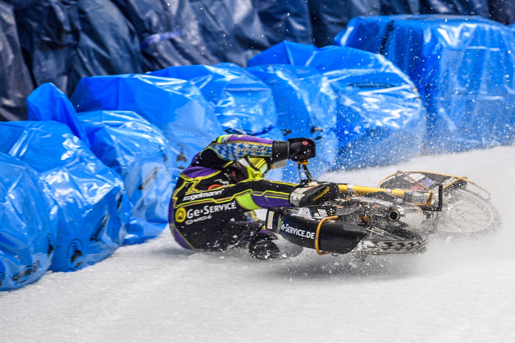 Max Niedermaier  (88) of Germany spins off and hits the bales during the Ice Speedway Gladiators World Championship Final 1 at Max-Aicher-Arena, Inzell on Saturday 15th March 2025. (Photo: Ian Charles | MI News)