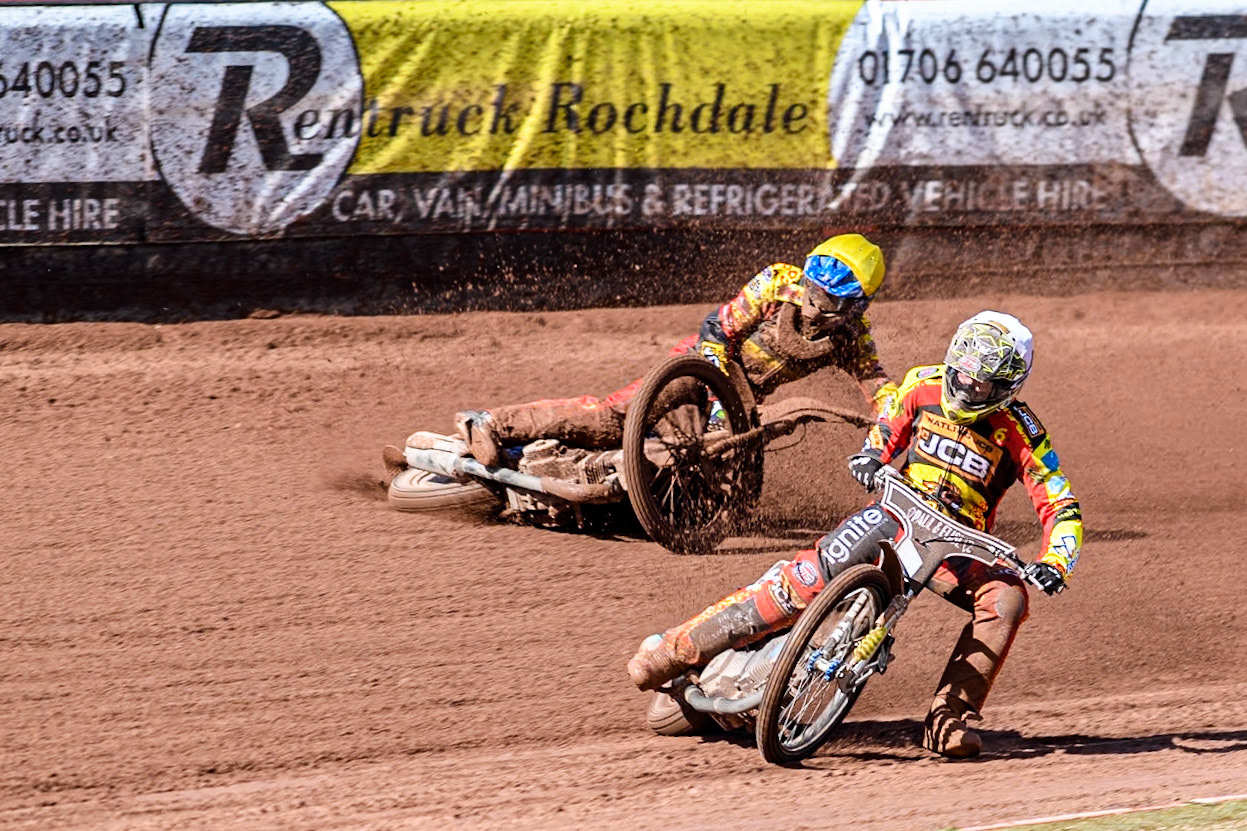 Leicester Lion Cubs' Sonny Springer  (Yellow) falls behind team mate Leicester Lion Cubs' Luke Crang (White) during the WSRA  National Development League match between Belle Vue Colts and Leicester Lion Cubs at the National Speedway Stadium, Manchester on Friday 29th March 2024. (Photo: Ian Charles | MI News)
