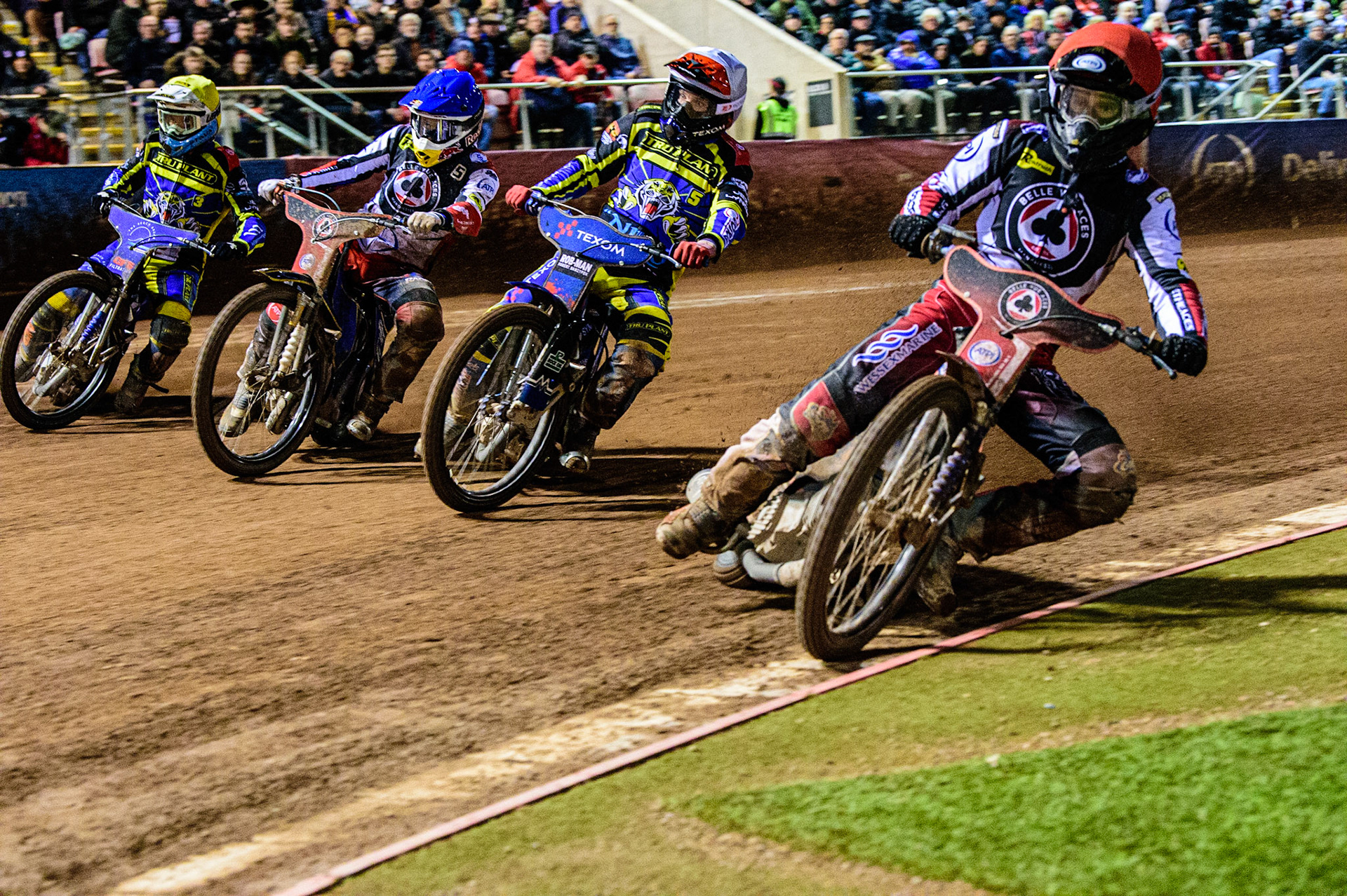 Brady Kurtz  (Red) inside \Tobiasz Musielak  (White), Robert Lambert  (Blue) and Adam Ellis  (Yellow) during the SGB Premiership Grand Final 1st leg between Belle Vue Aces and Sheffield Tigers at the National Speedway Stadium, Manchester on Monday 10th October 2022. (Credit: Ian Charles | MI News)